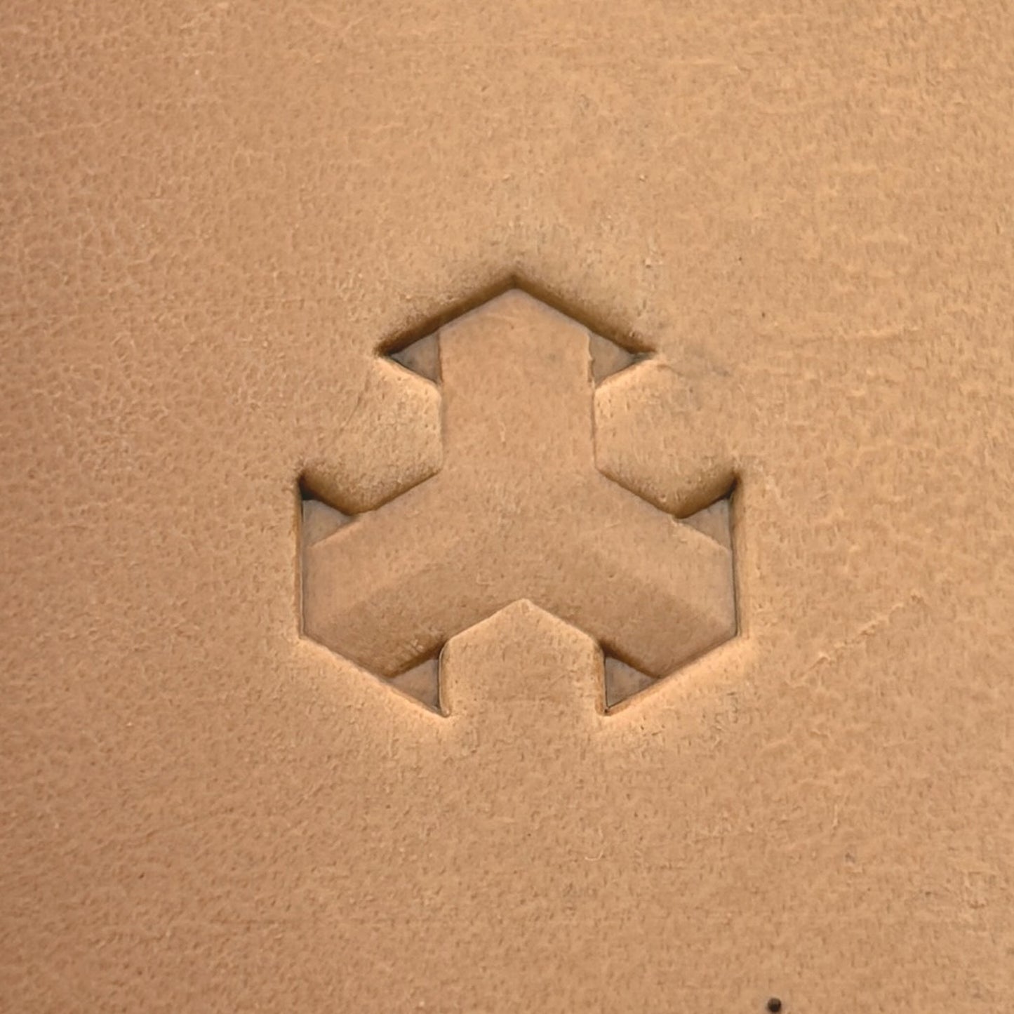 Geometric leather stamp LT004 — single impression on veg-tan leather