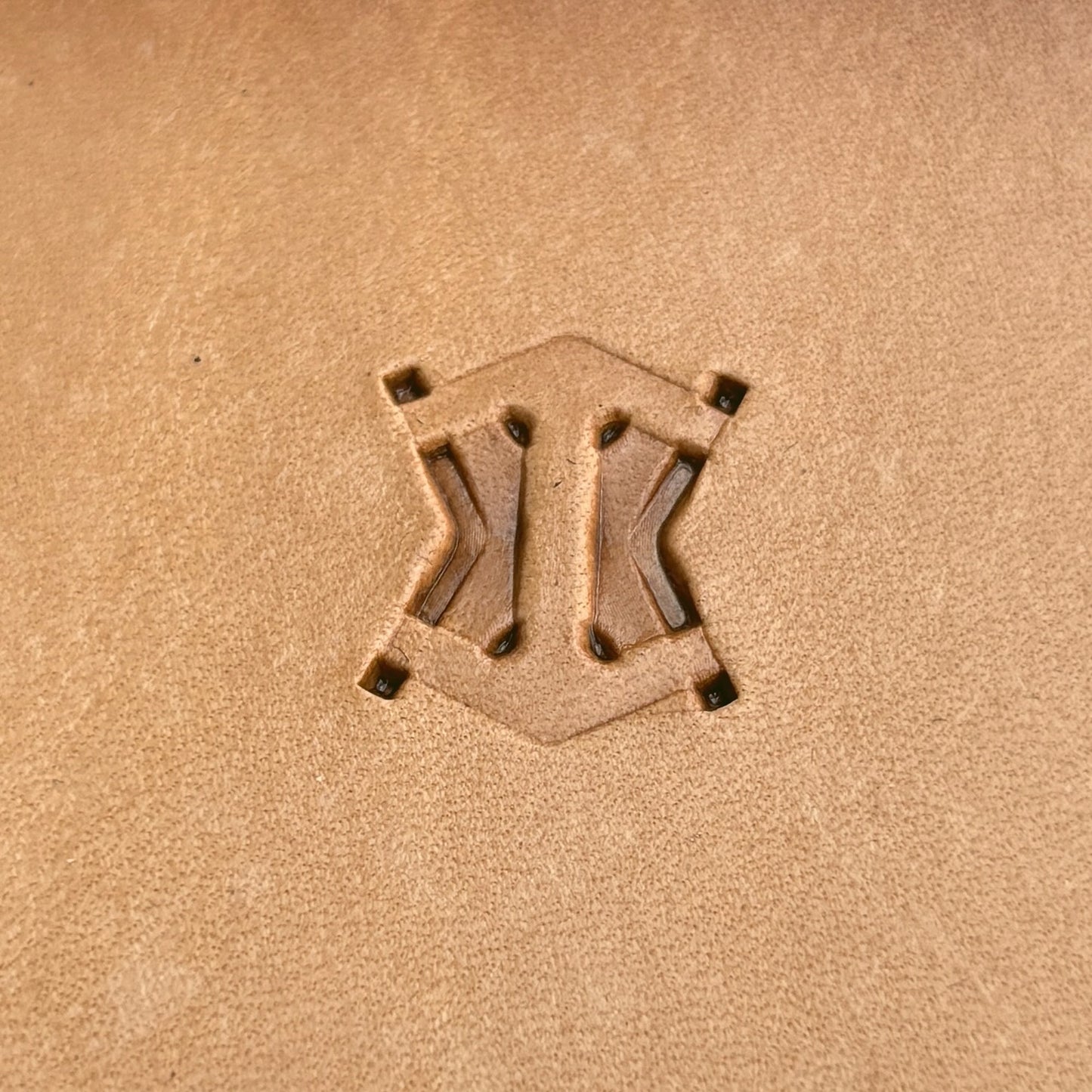 Geometric leather stamp LT013 — single impression on veg-tan leather