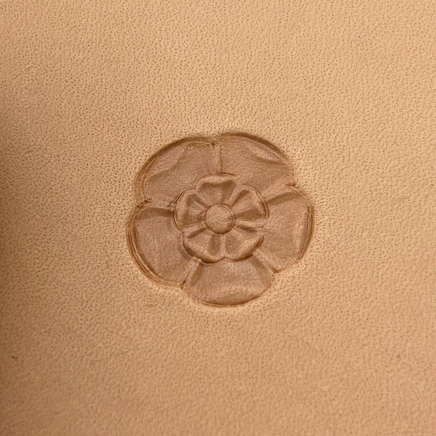 Tudor Flower leather stamp LT017 — single impression on veg-tan leather