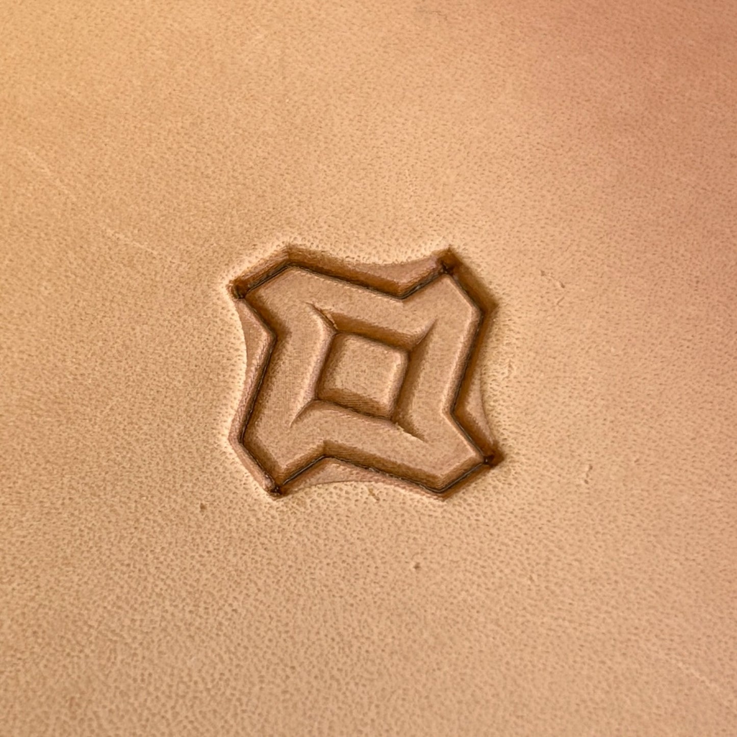 Geometric leather stamp LT026 — single impression on veg-tan leather