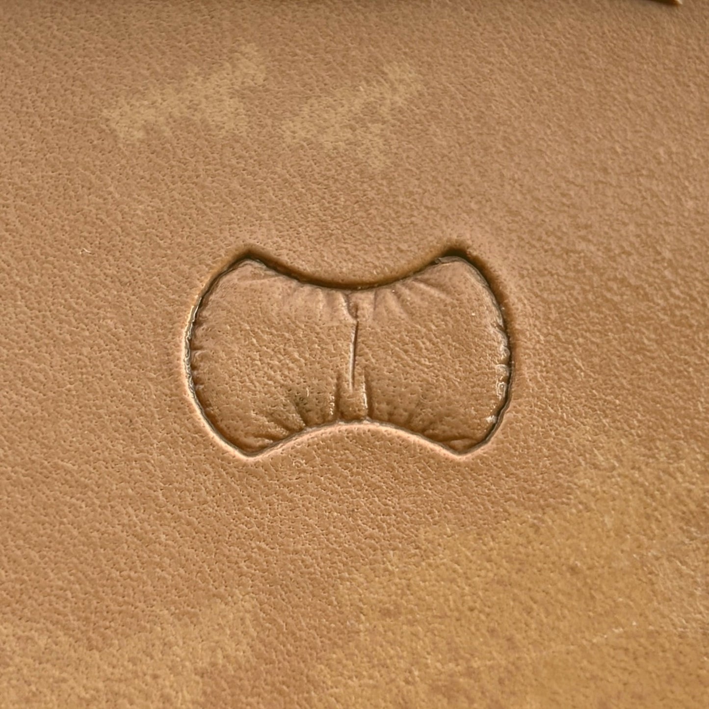 Scales leather stamp LT033 — single impression on veg-tan leather