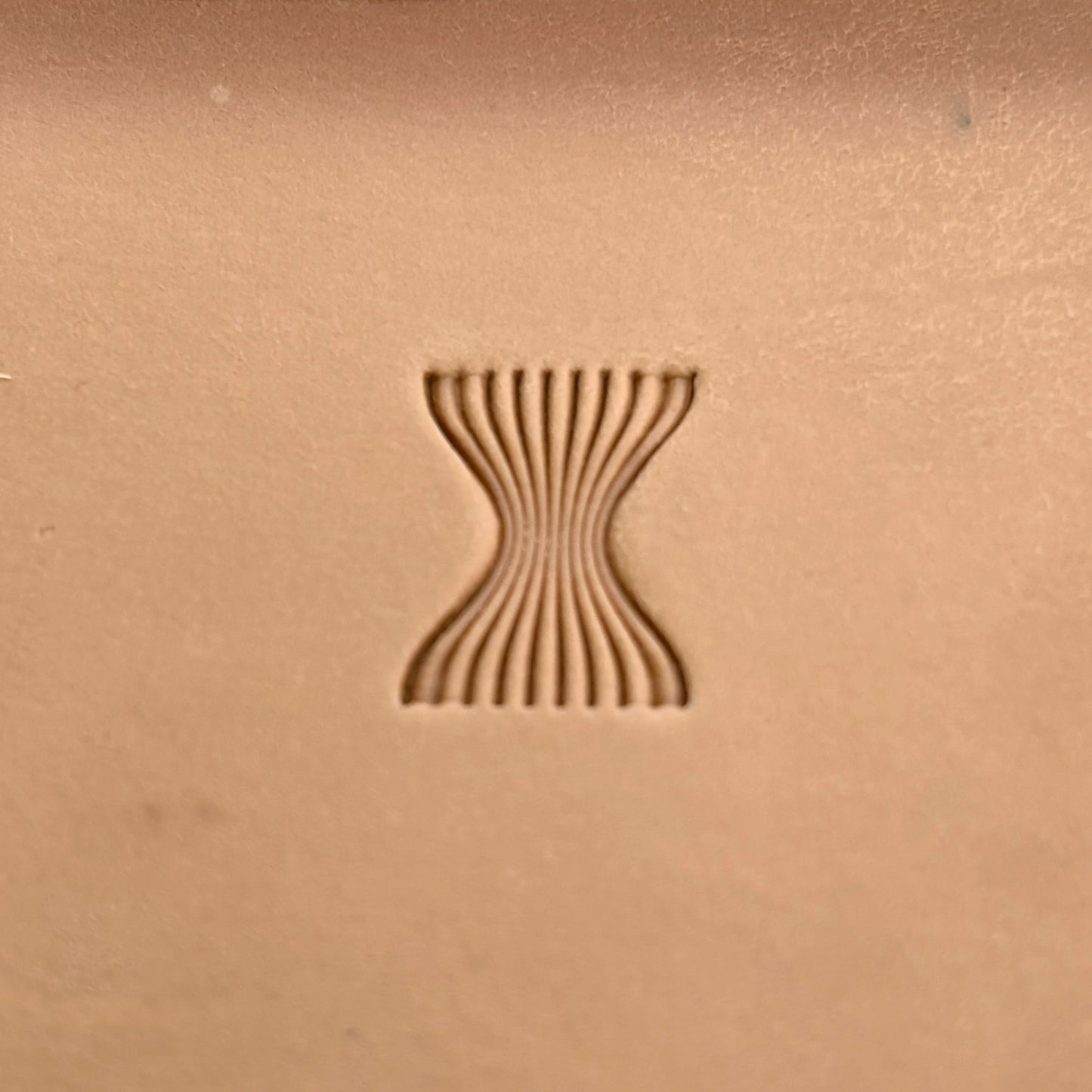 Wavy Lines leather stamp LT044 — single impression on veg-tan leather