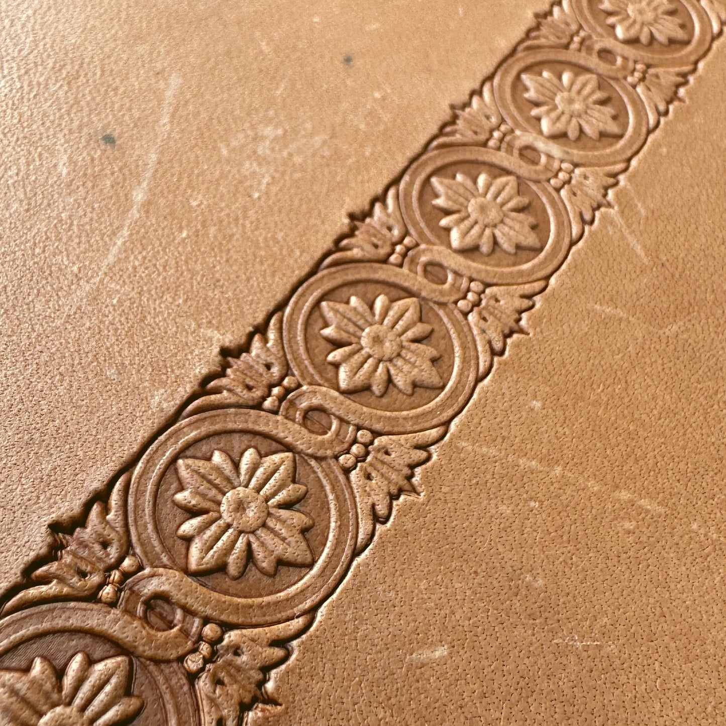 Flower leather stamp LT076 — single impression on veg-tan leather