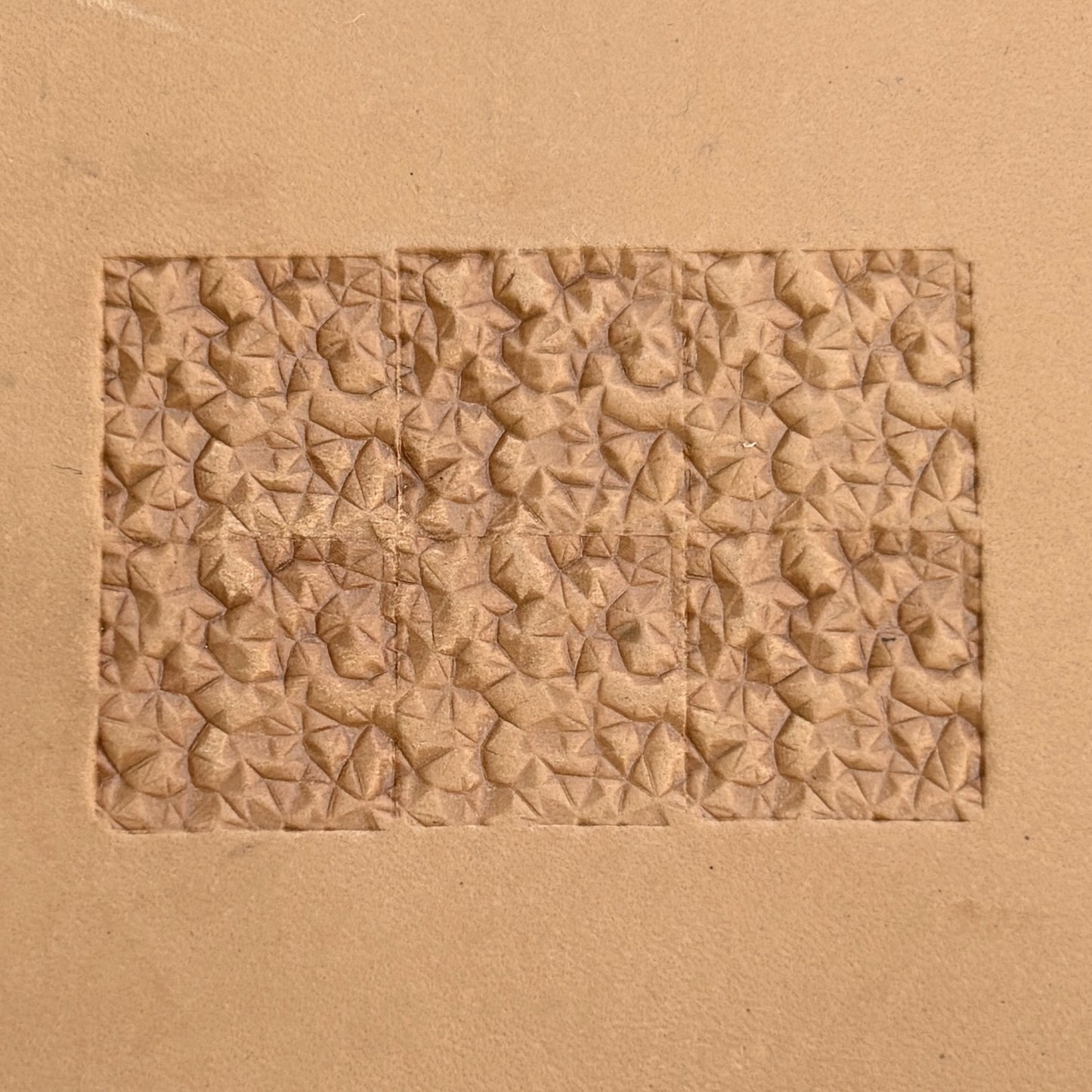 Geometric leather stamp LT085 — single impression on veg-tan leather