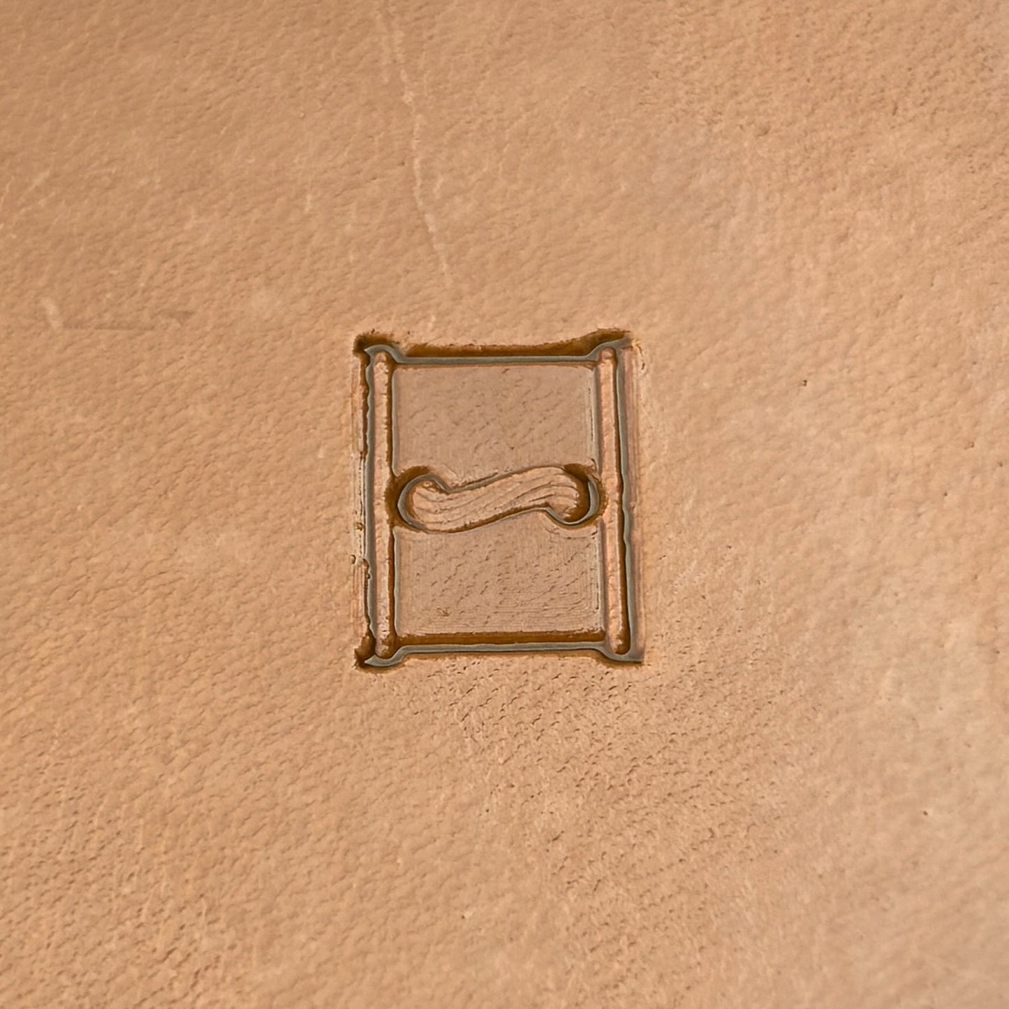 Boxed Line Stitches leather stamp LT087 — single impression on veg-tan leather