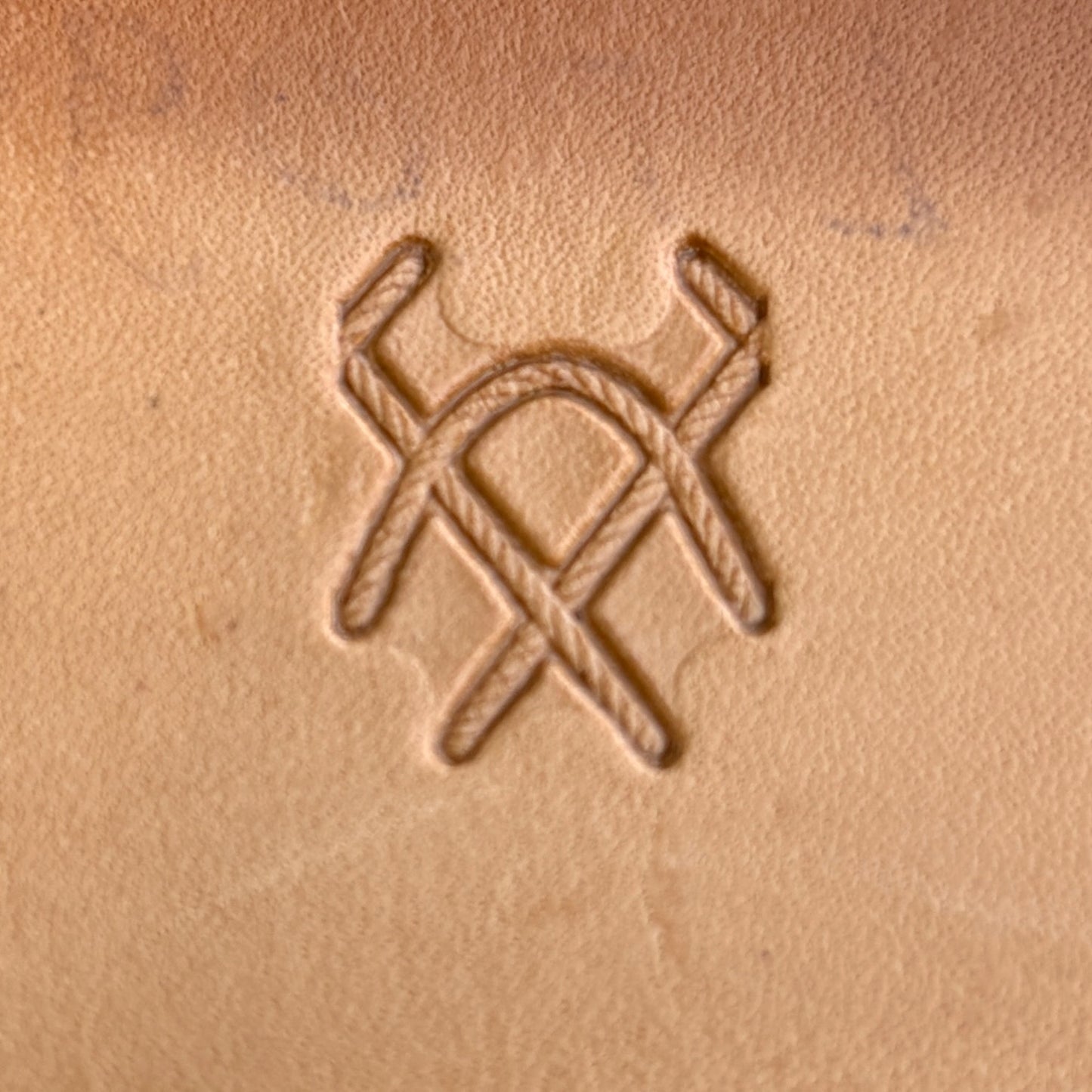 Geometric leather stamp LT091 — single impression on veg-tan leather