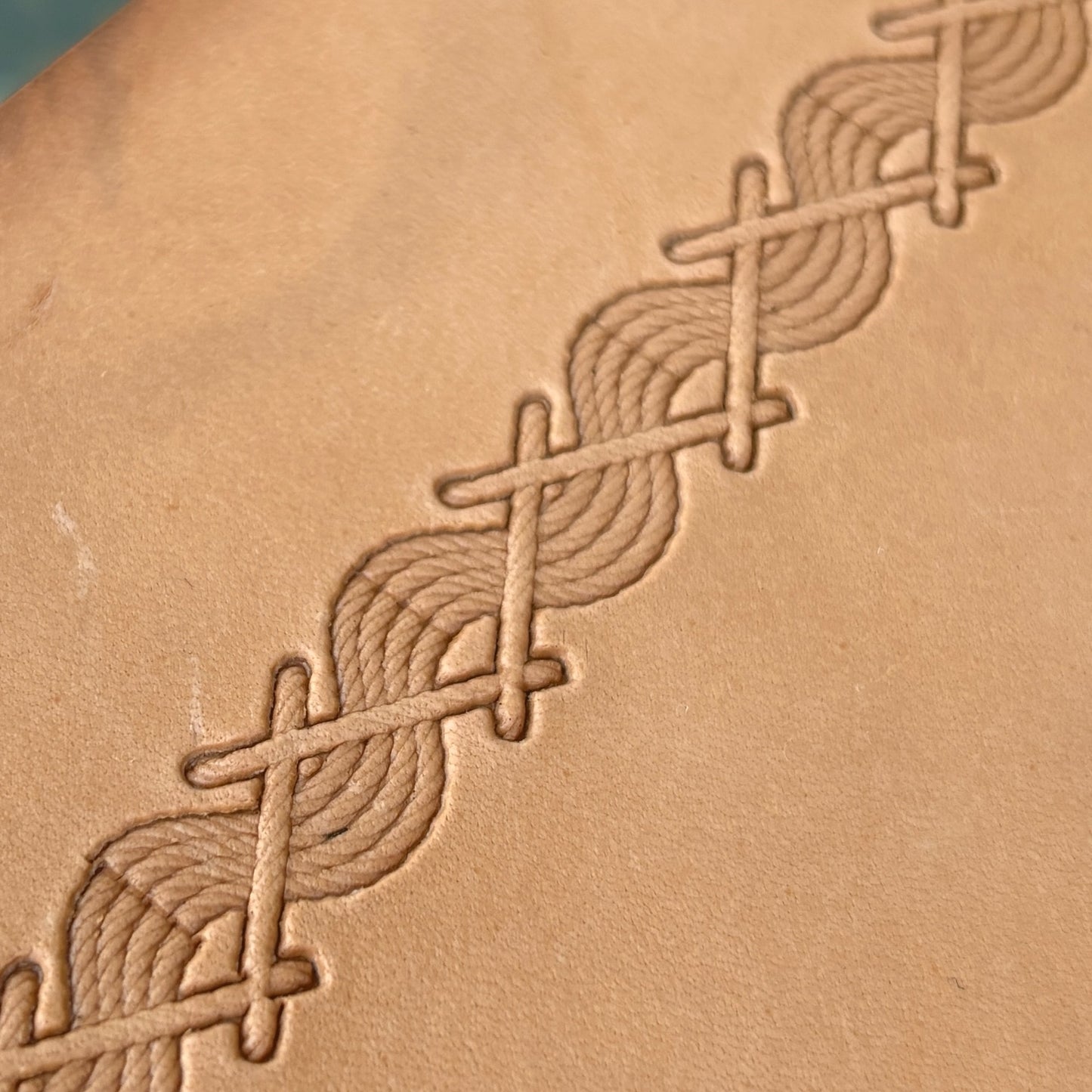 Twisted Line Stitches leather stamp LT093 — single impression on veg-tan leather
