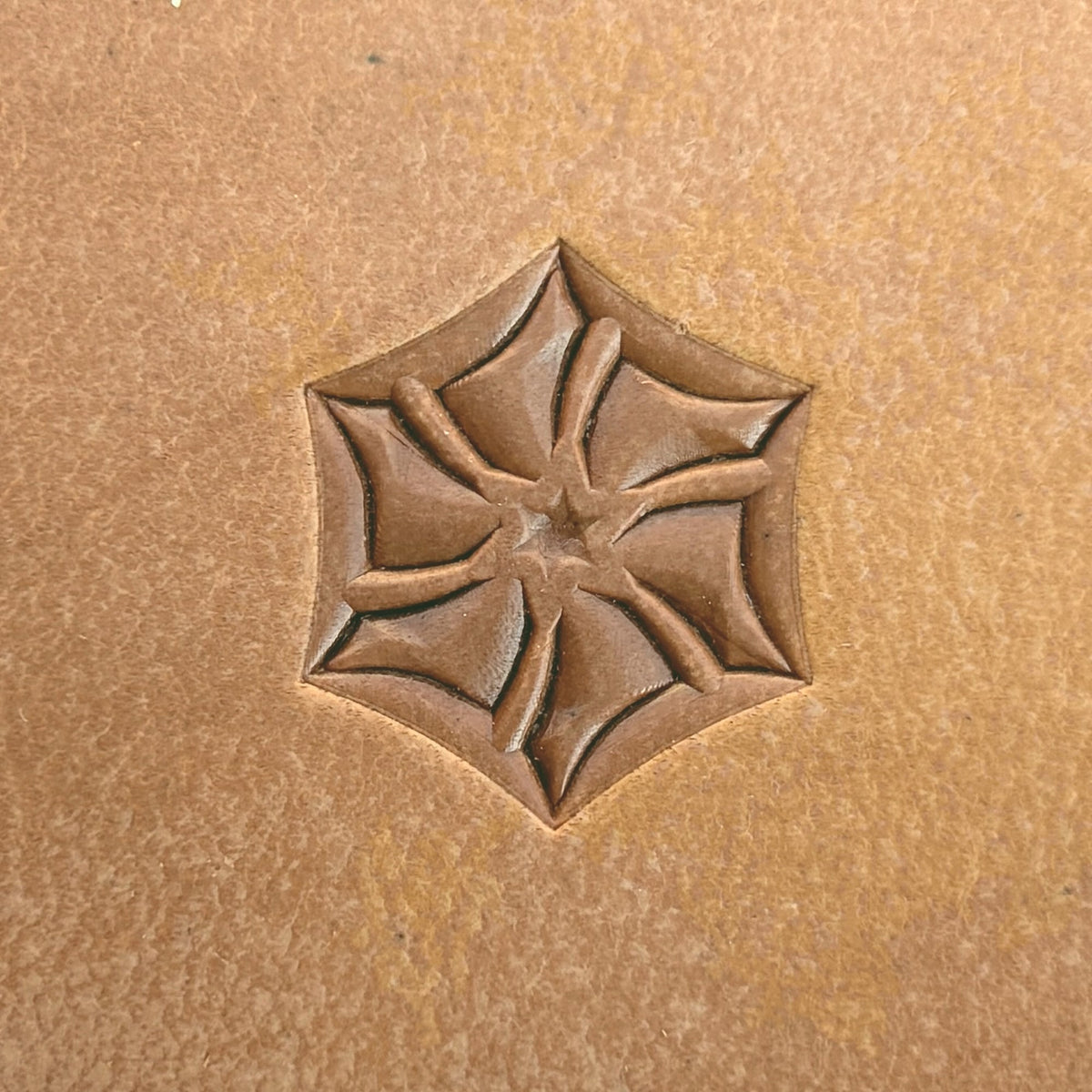 Star Tile Geometric leather stamp LT112 — single impression on veg-tan leather