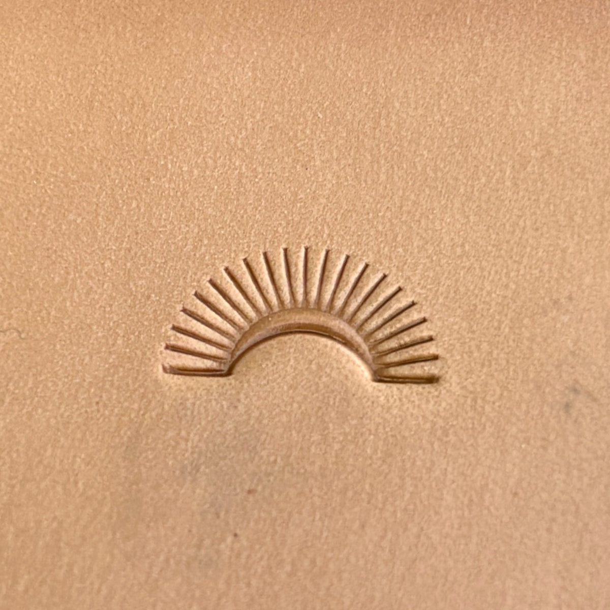 Sunburst Border leather stamp LT124 — pattern imprint on veg-tan leather