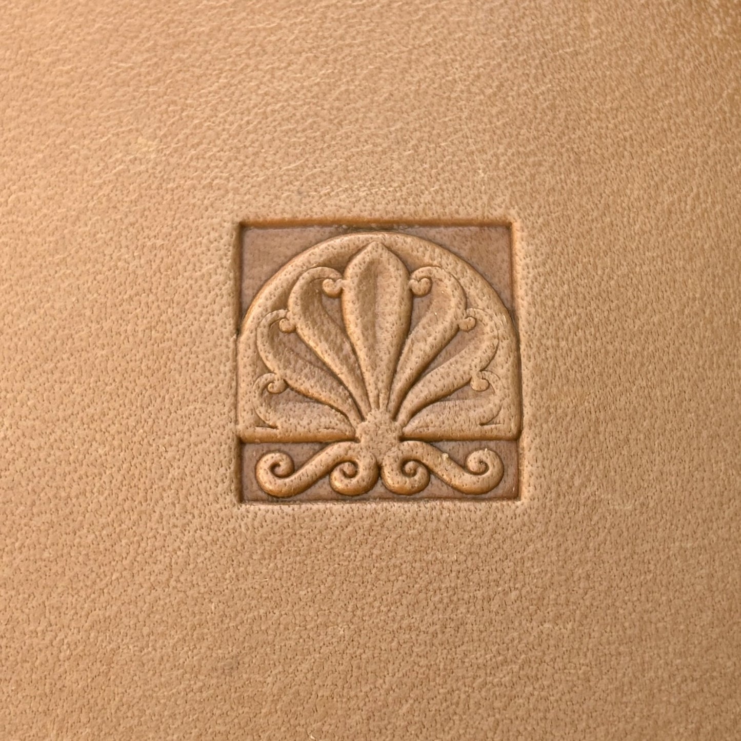Fleur leather stamp LT136 — single impression on veg-tan leather