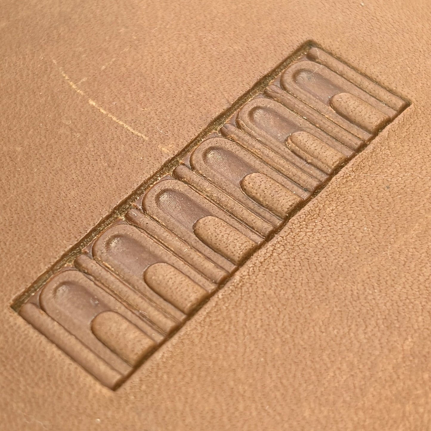 Arch Border Geometric leather stamp LT137 — single impression on veg-tan leather
