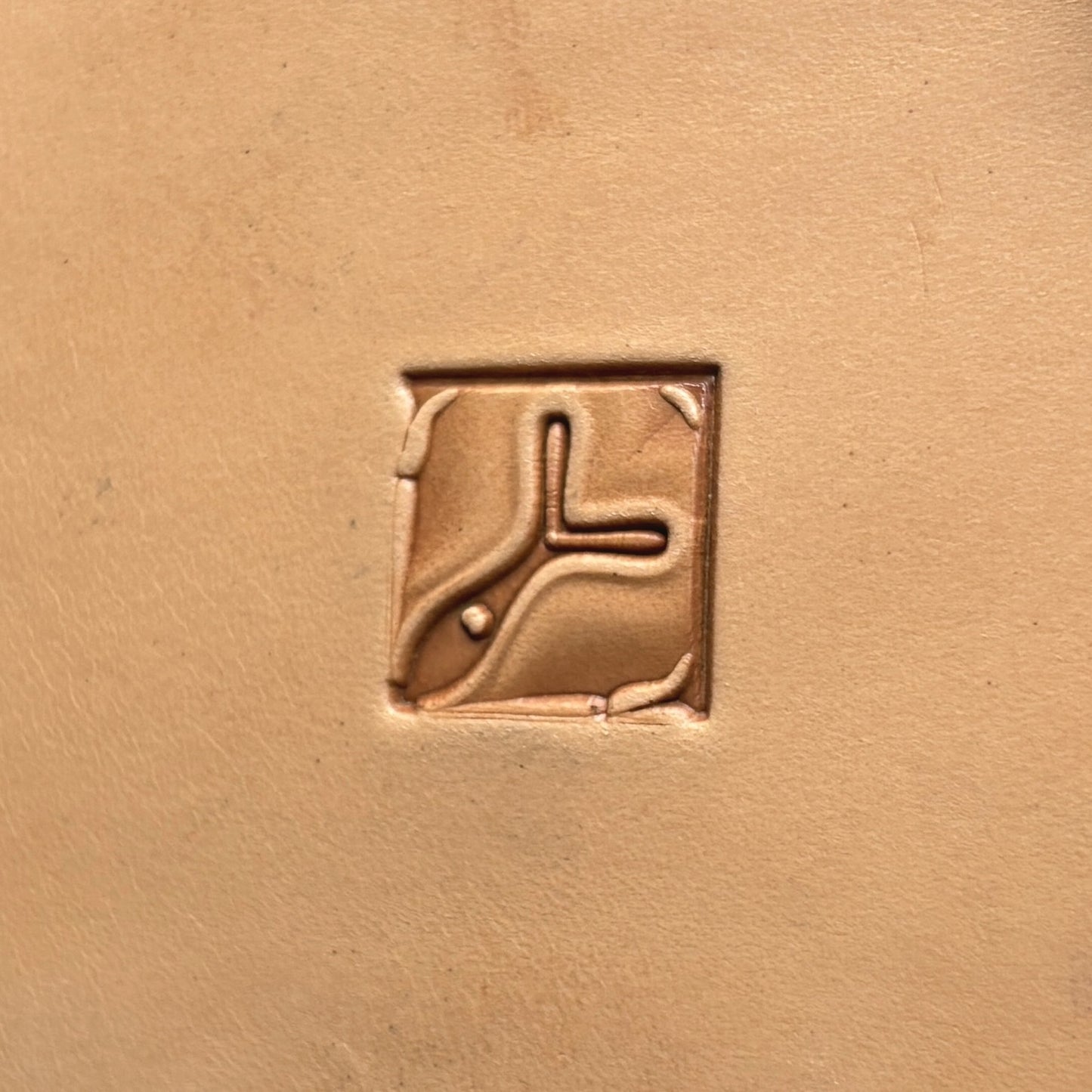 Ornate Tile leather stamp LT139 — single impression on veg-tan leather