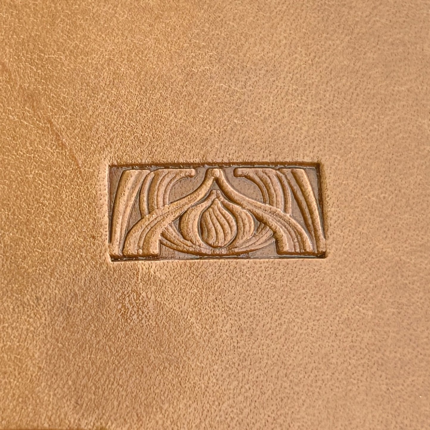 Art Deco leather stamp LT143 — single impression on veg-tan leather