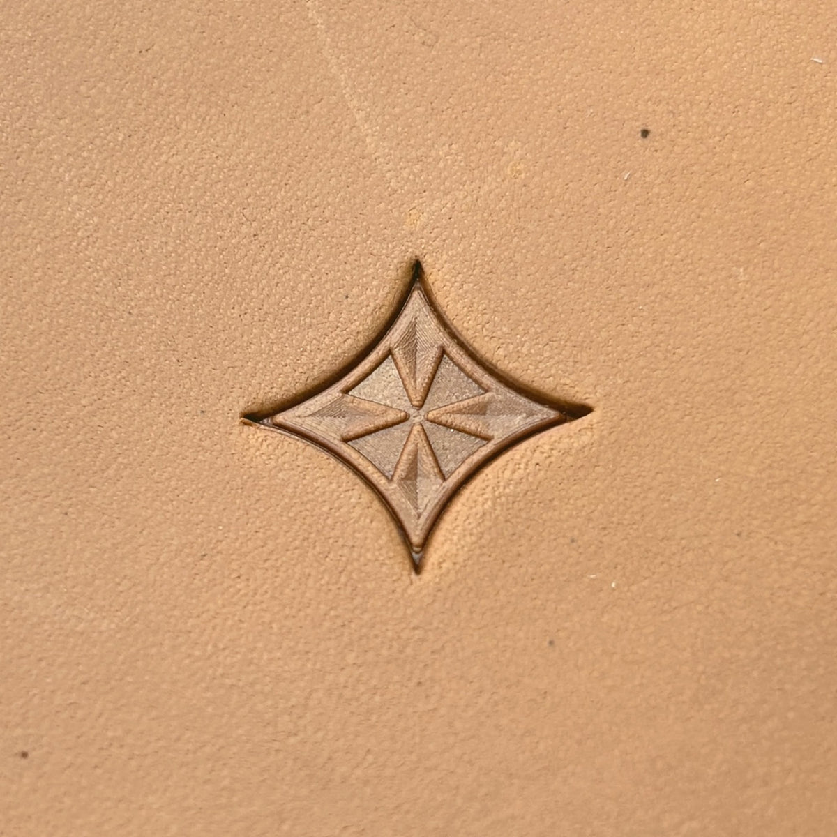 Star Tile Geometric leather stamp LT221 — single impression on veg-tan leather