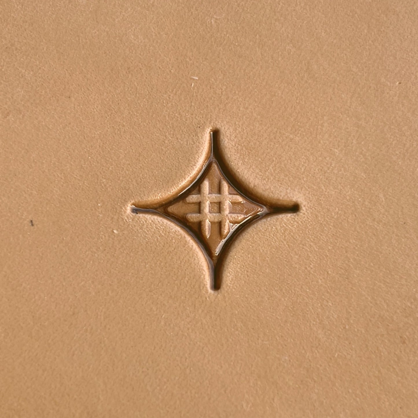 Geometric leather stamp LT226 — single impression on veg-tan leather