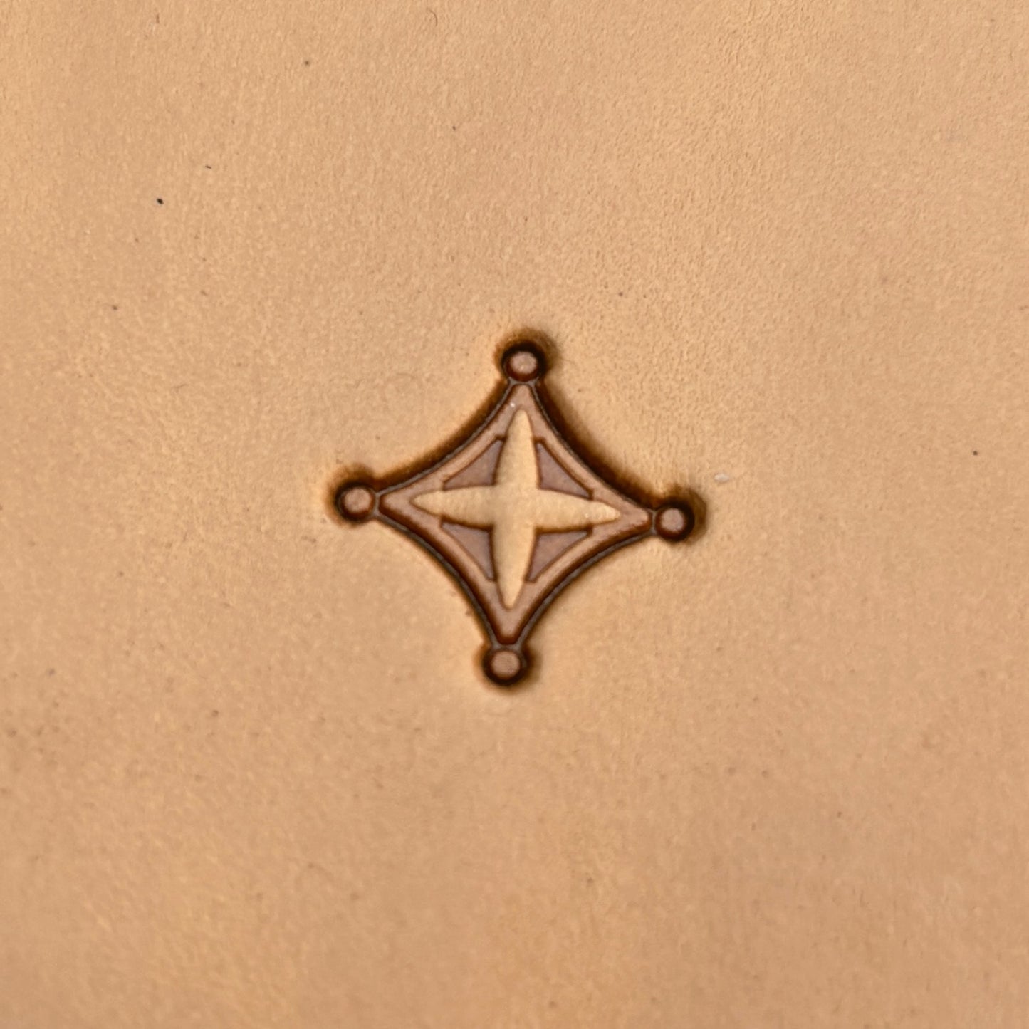 Geometric leather stamp LT228 — single impression on veg-tan leather