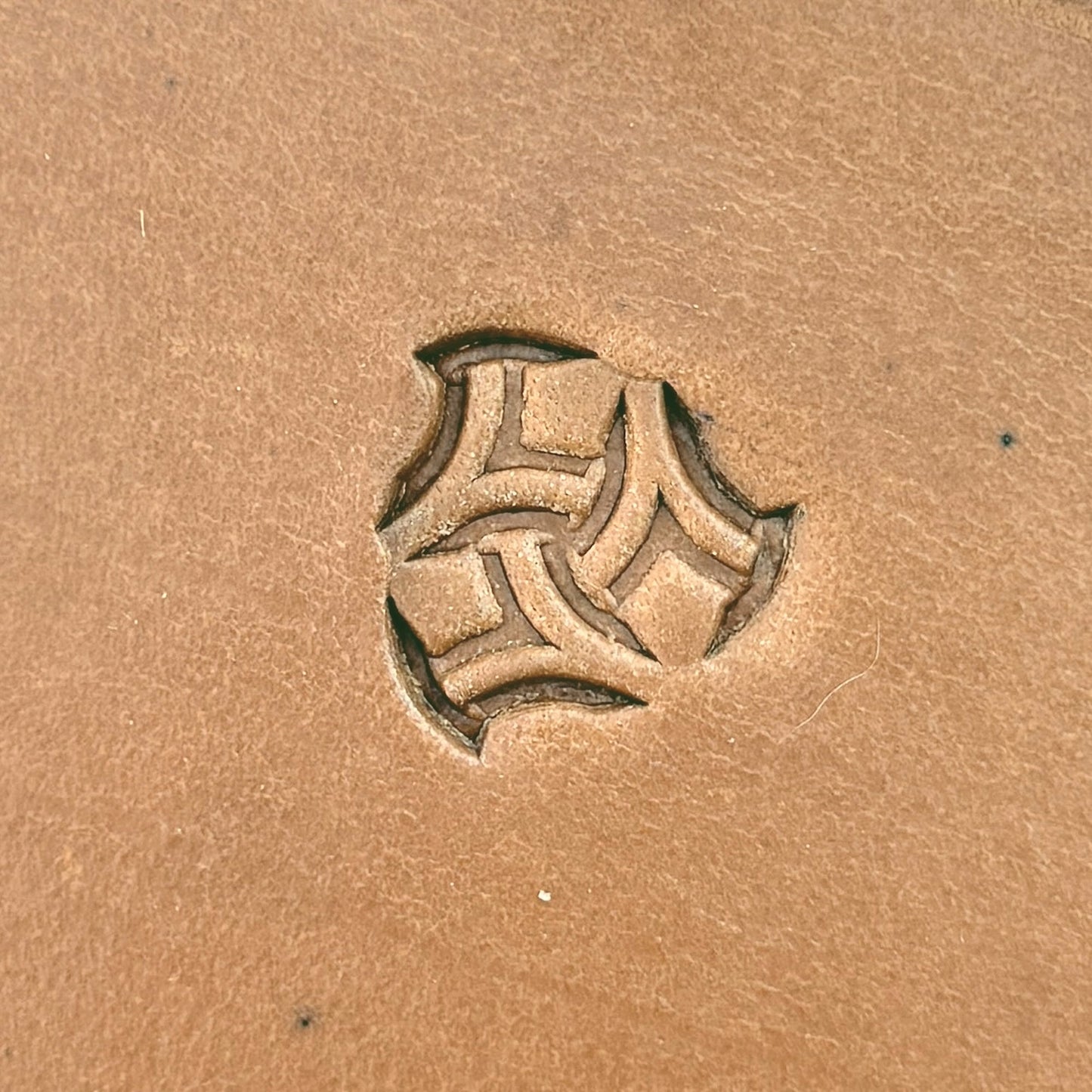 Interlock Shape Geometric leather stamp LT241 — single impression on veg-tan leather