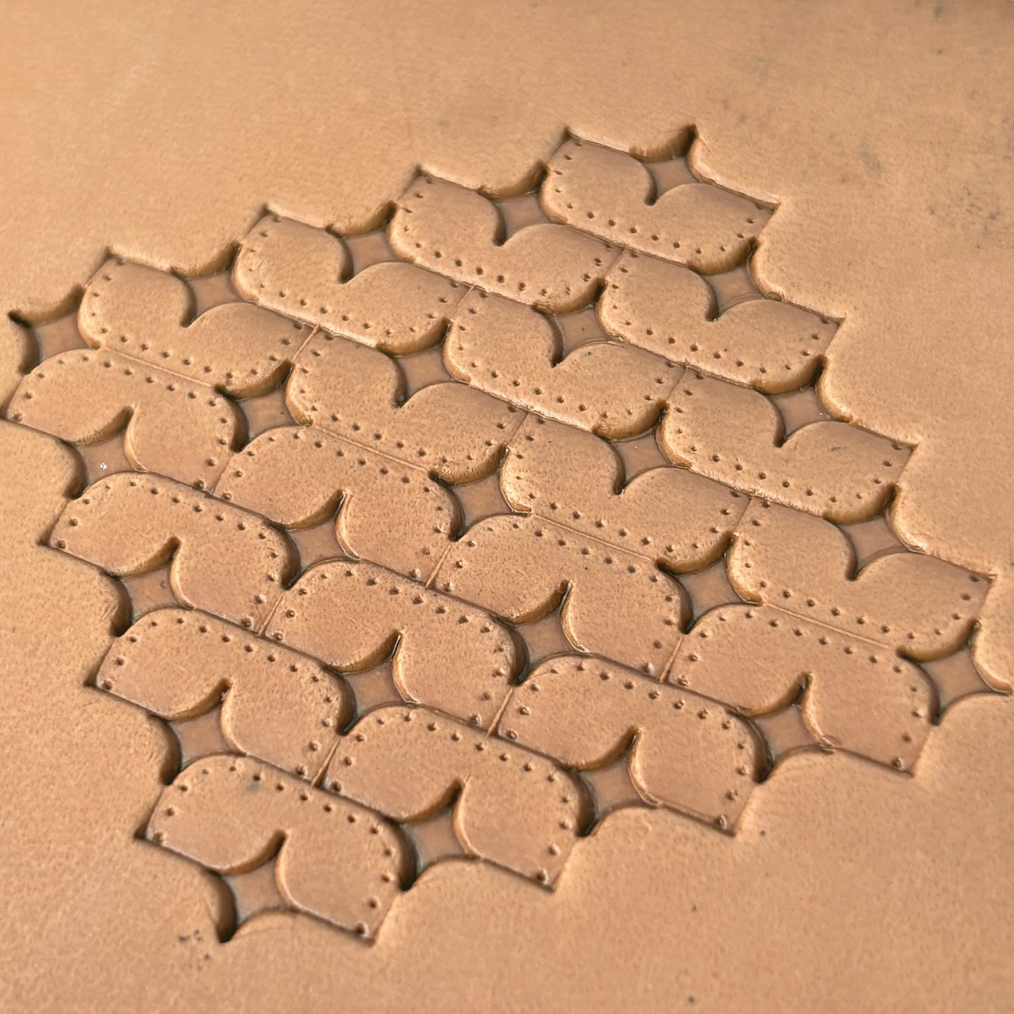 Star Tiles leather stamp LT273 — single impression on veg-tan leather