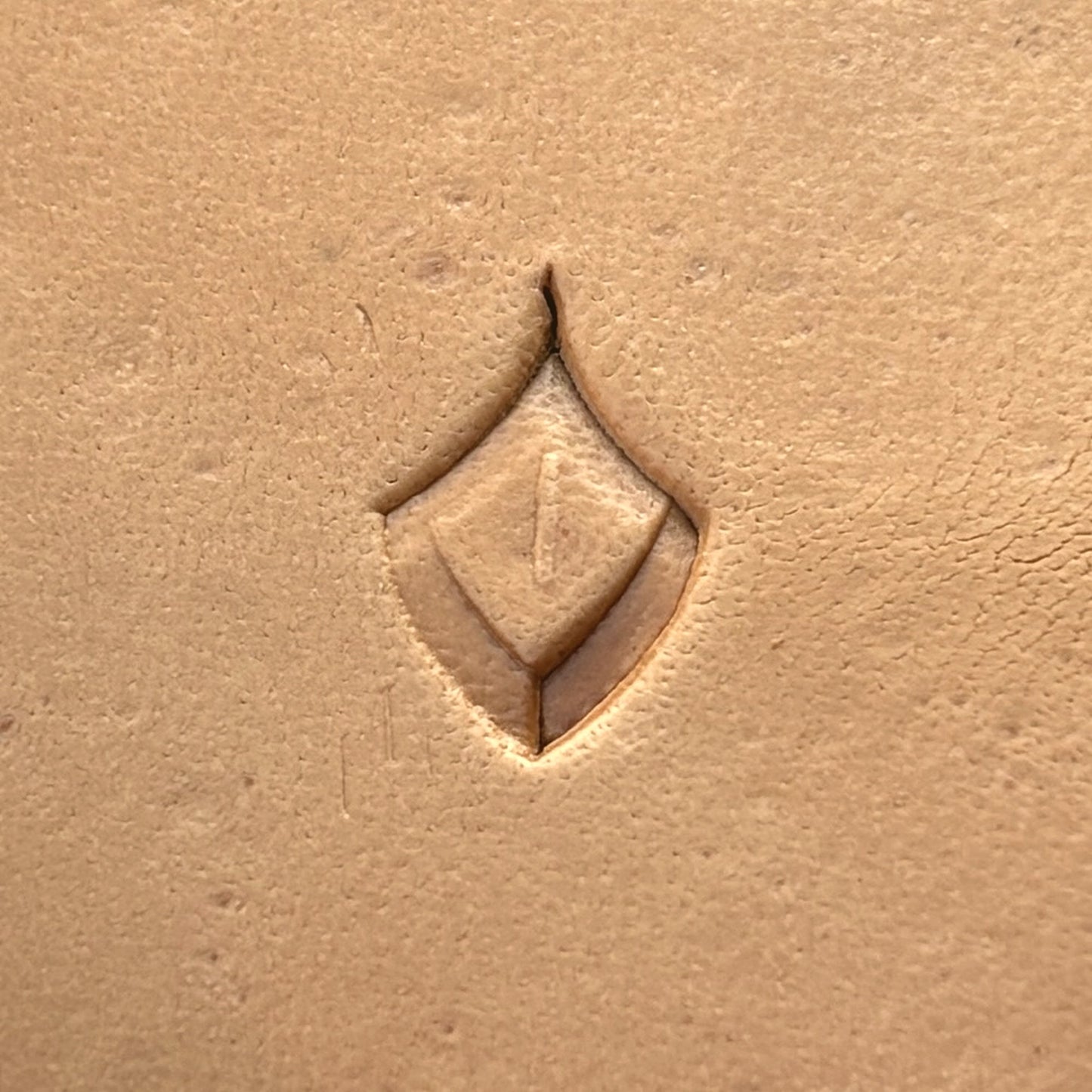 Geometric leather stamp LT284 — single impression on veg-tan leather