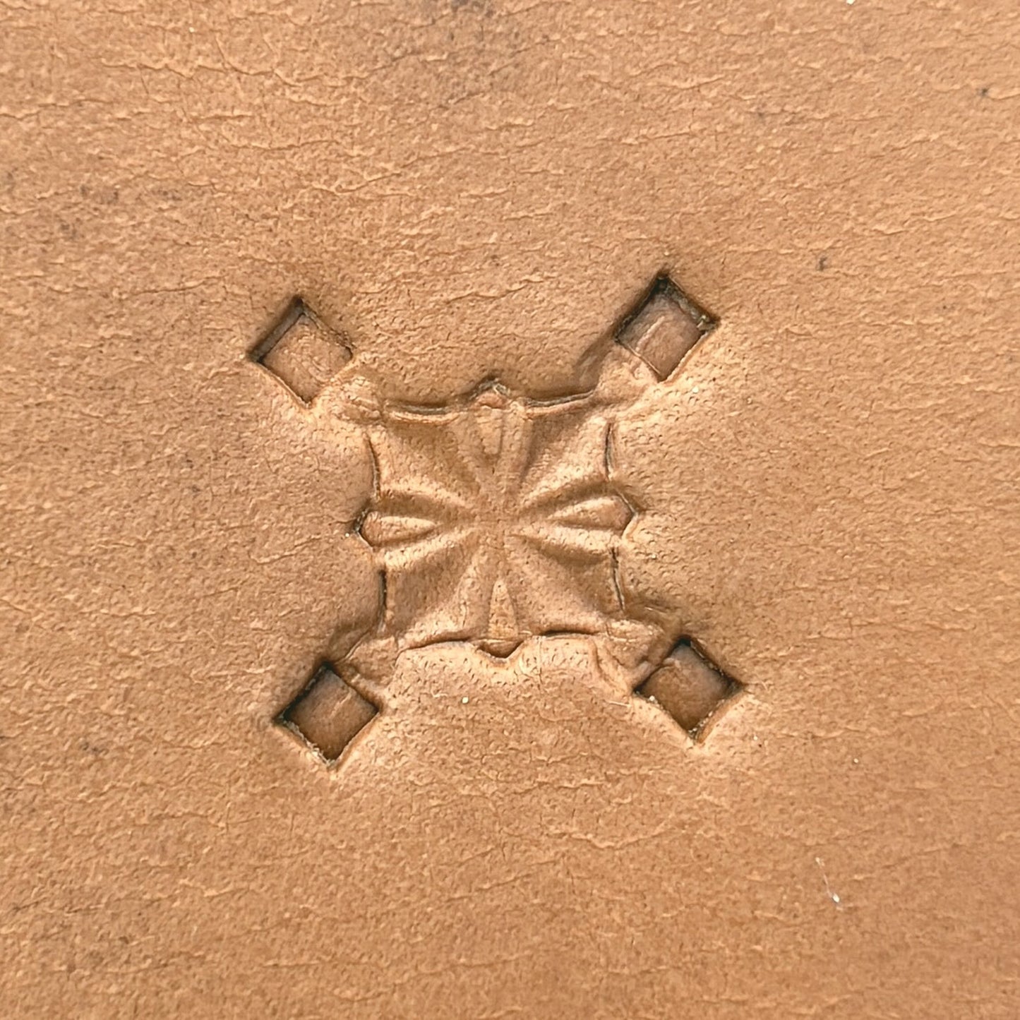 Star Center Geometric leather stamp LT304 — single impression on veg-tan leather