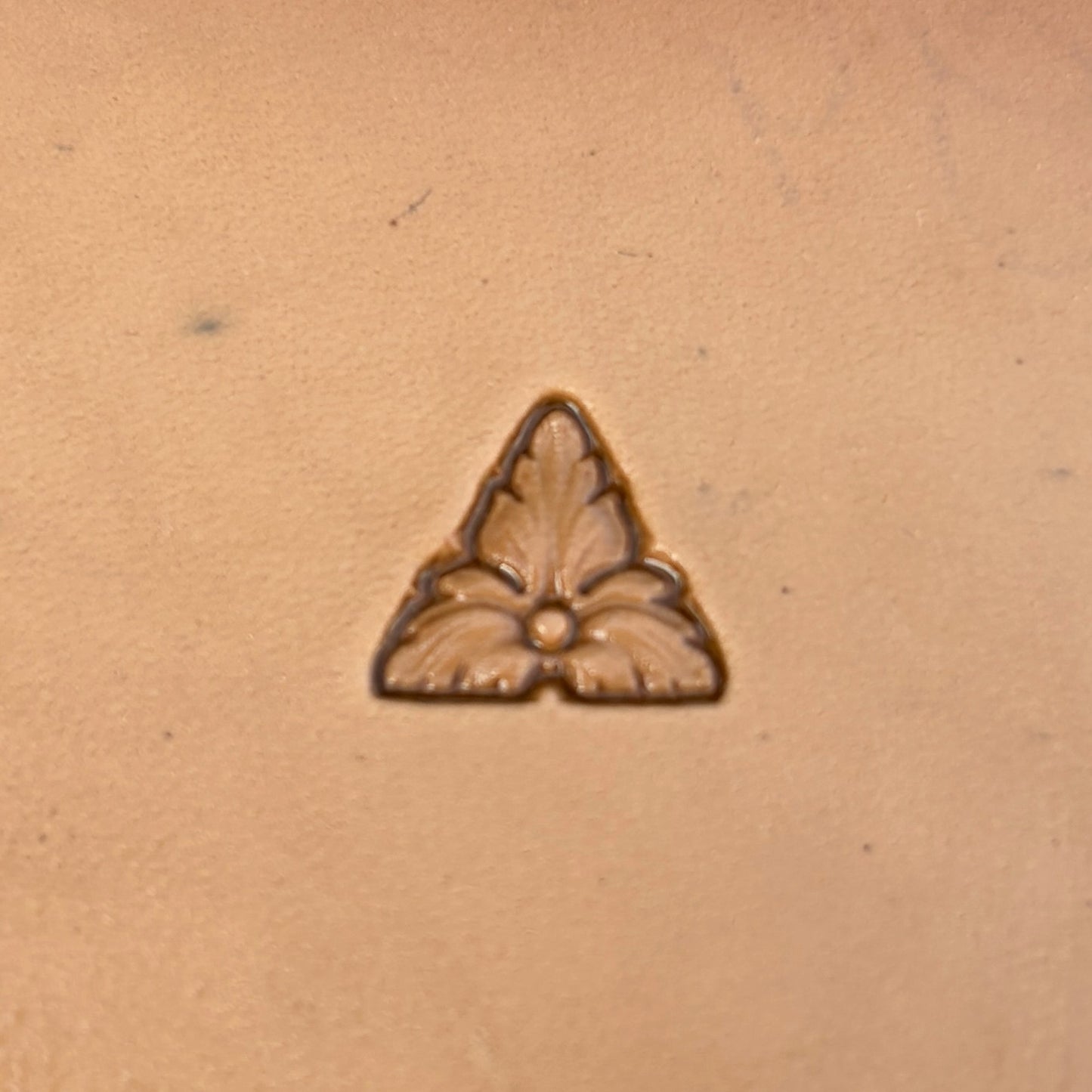 Fleur Accent leather stamp LT329 — single impression on veg-tan leather
