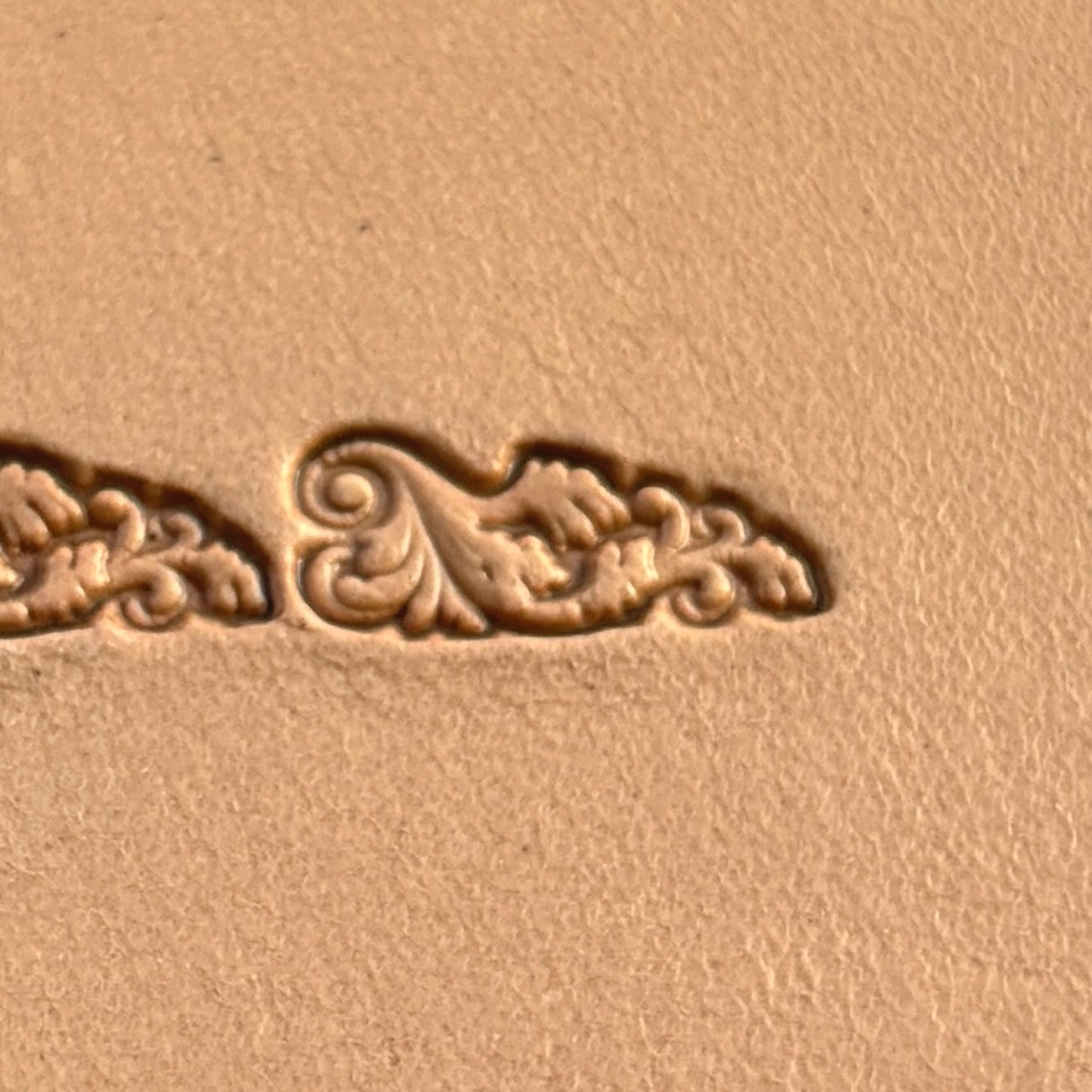 Scroll Border leather stamp LT331 — single impression on veg-tan leather