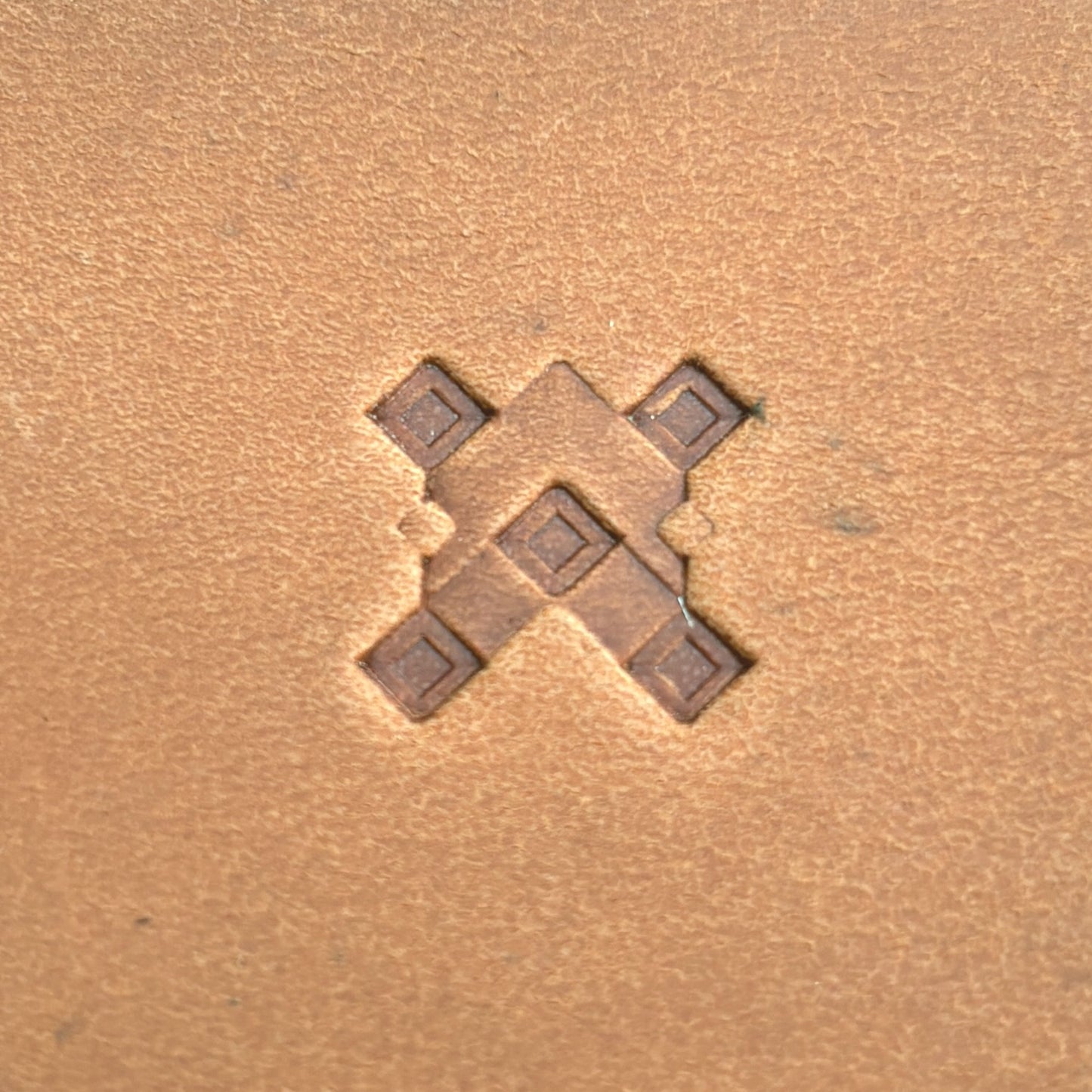 Geometric leather stamp LT355 — single impression on veg-tan leather