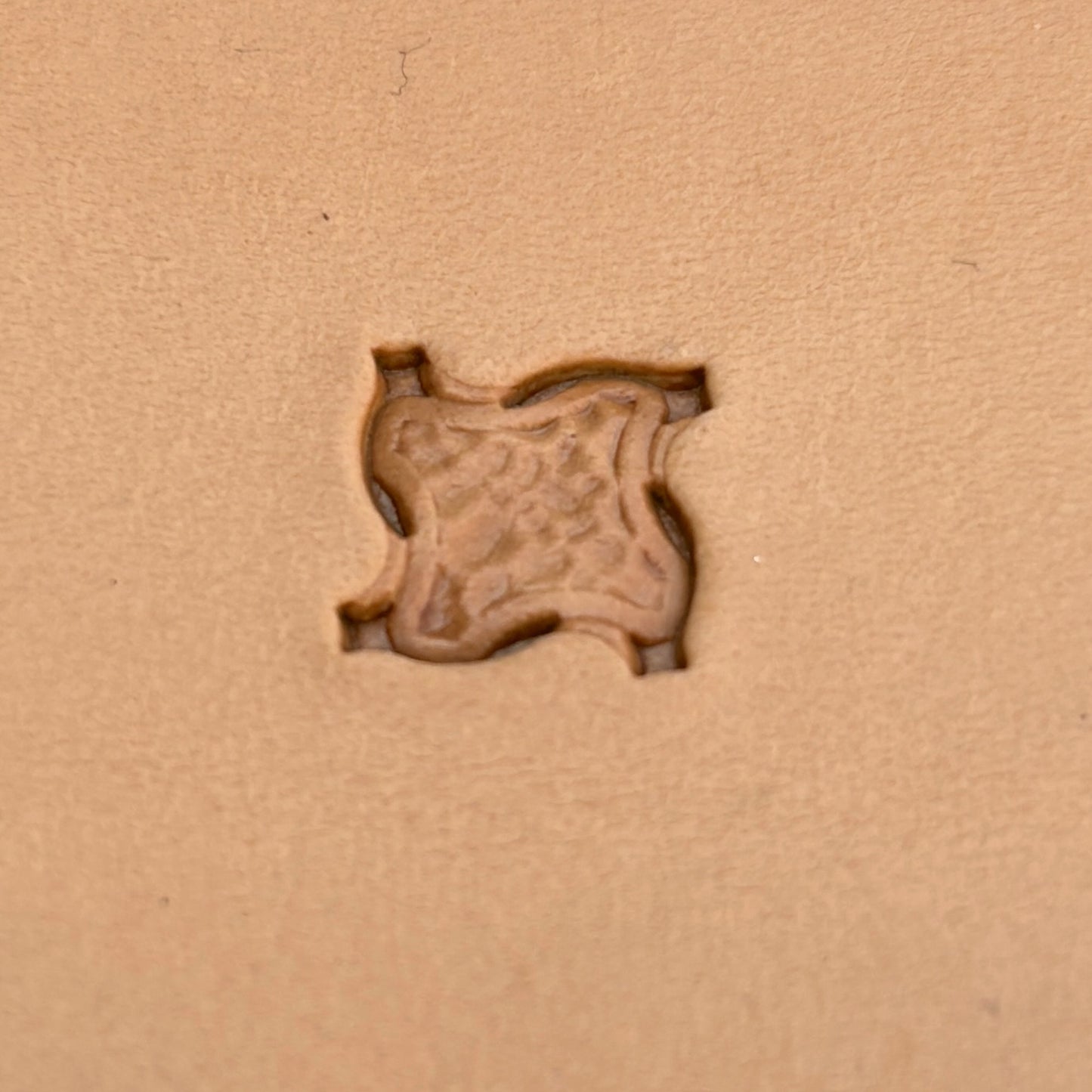 Geometric leather stamp LT362 — single impression on veg-tan leather