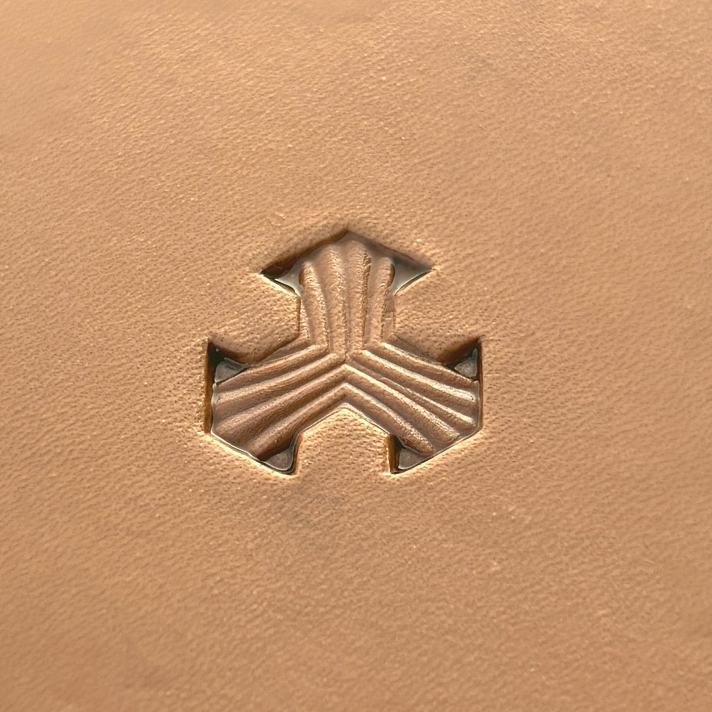 Geometric leather stamp LT378 — single impression on veg-tan leather