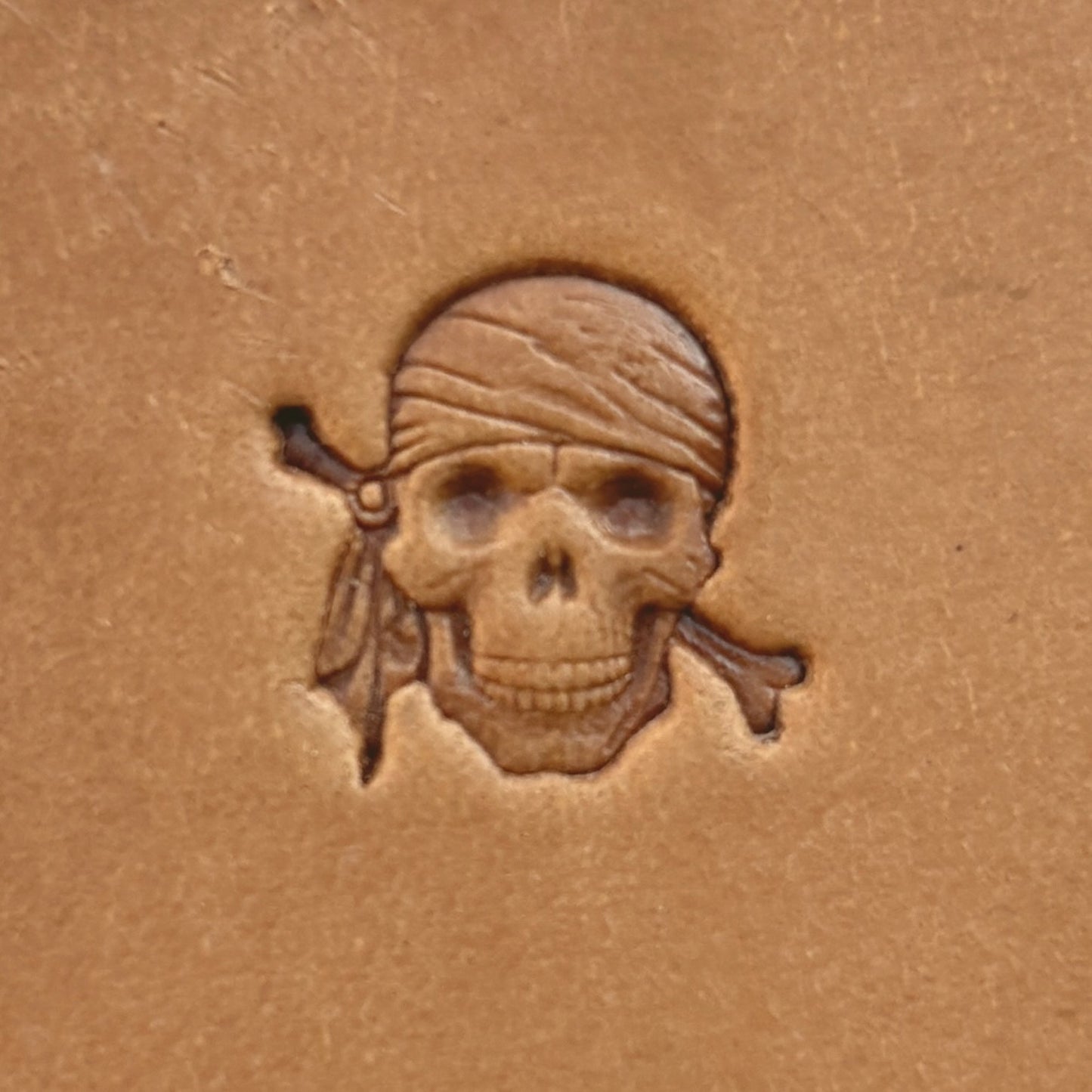 Pirate Skull leather stamp LT551 — single impression on veg-tan leather
