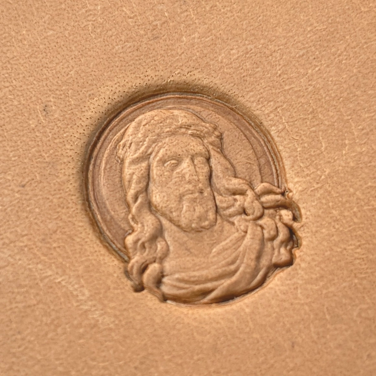 Sacred Portrait leather stamp LT651 — single impression on veg-tan leather
