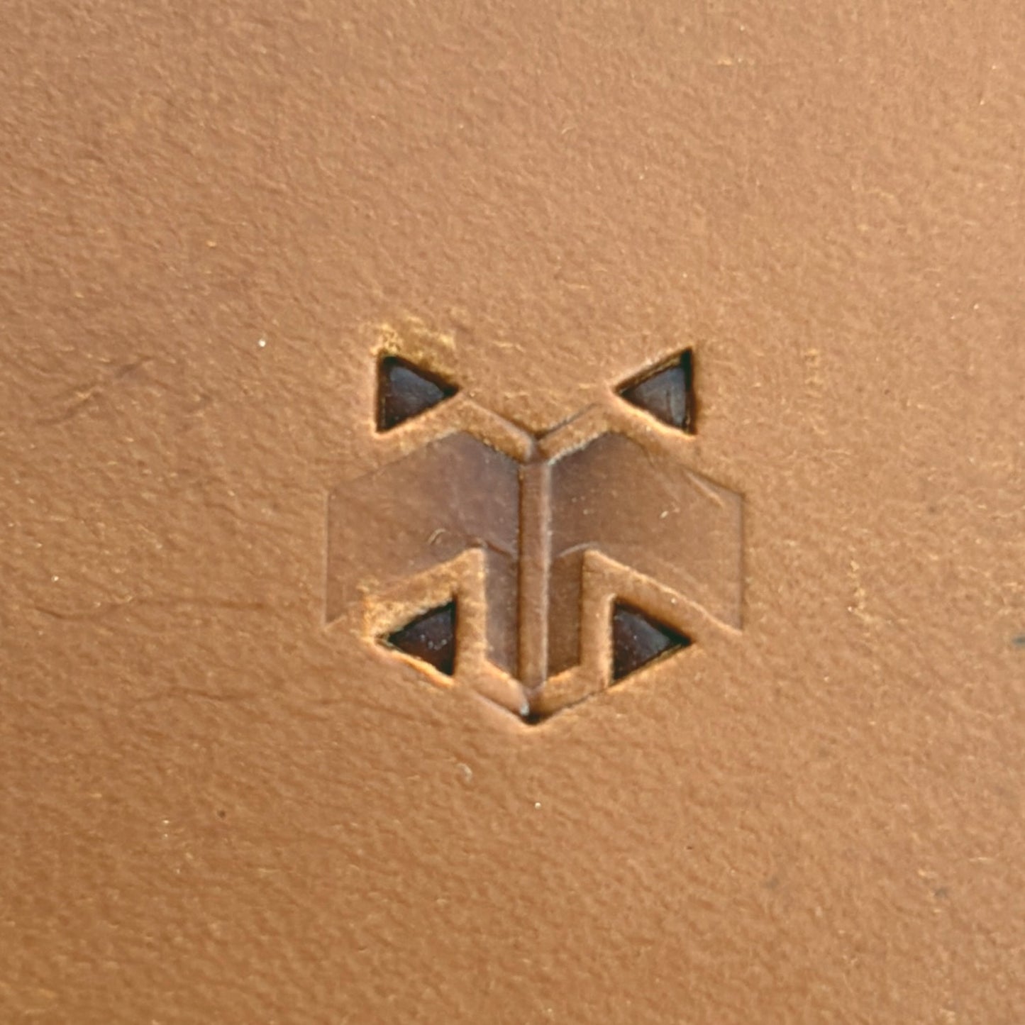 Smooth Hex Tile leather stamp LT827 — single impression on veg-tan leather