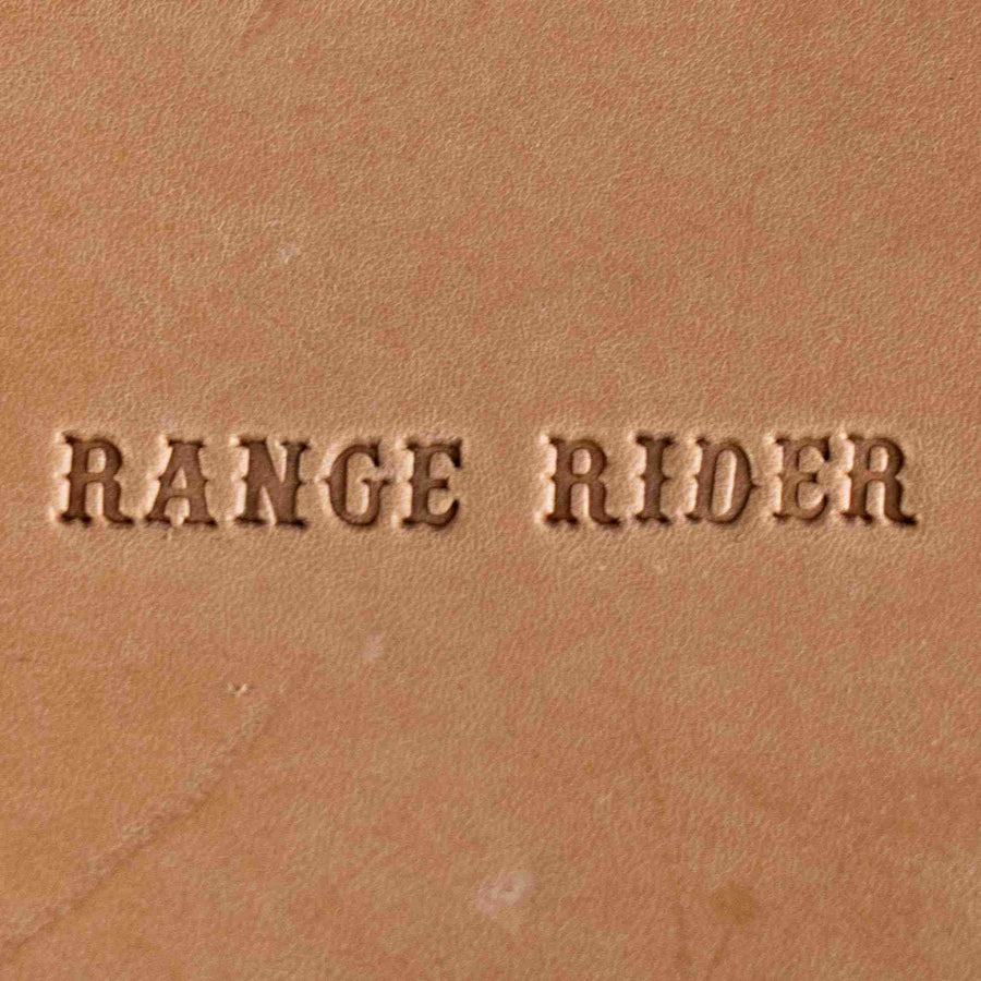 The words RANGE RIDER stamped into tan leather with an alphabet steel stamp set.