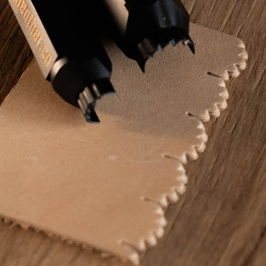 The CT001 leather edge cutter shaping a scalloped edge.