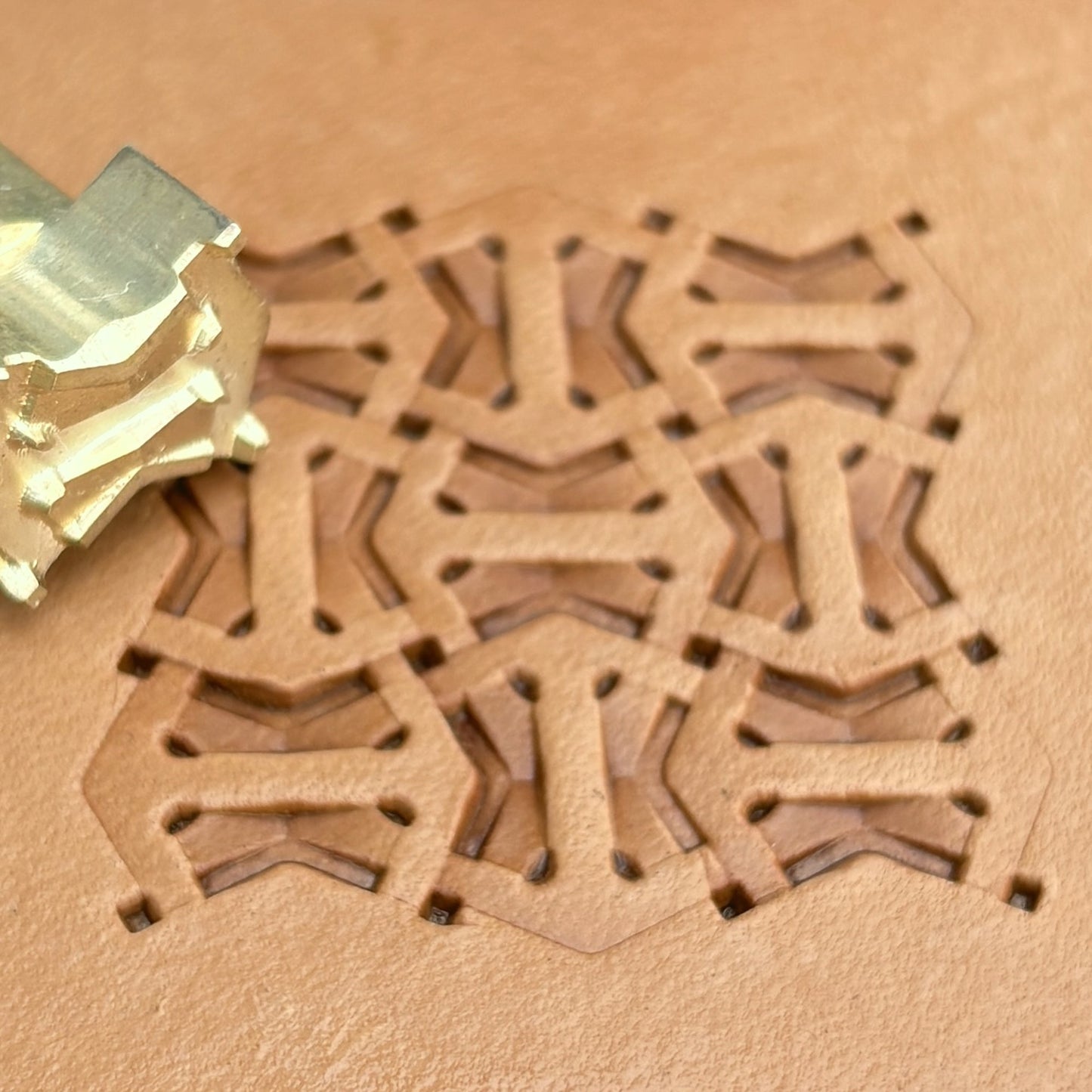 Geometric leather stamp LT013 — brass stamping tool with imprint on natural veg-tan leather