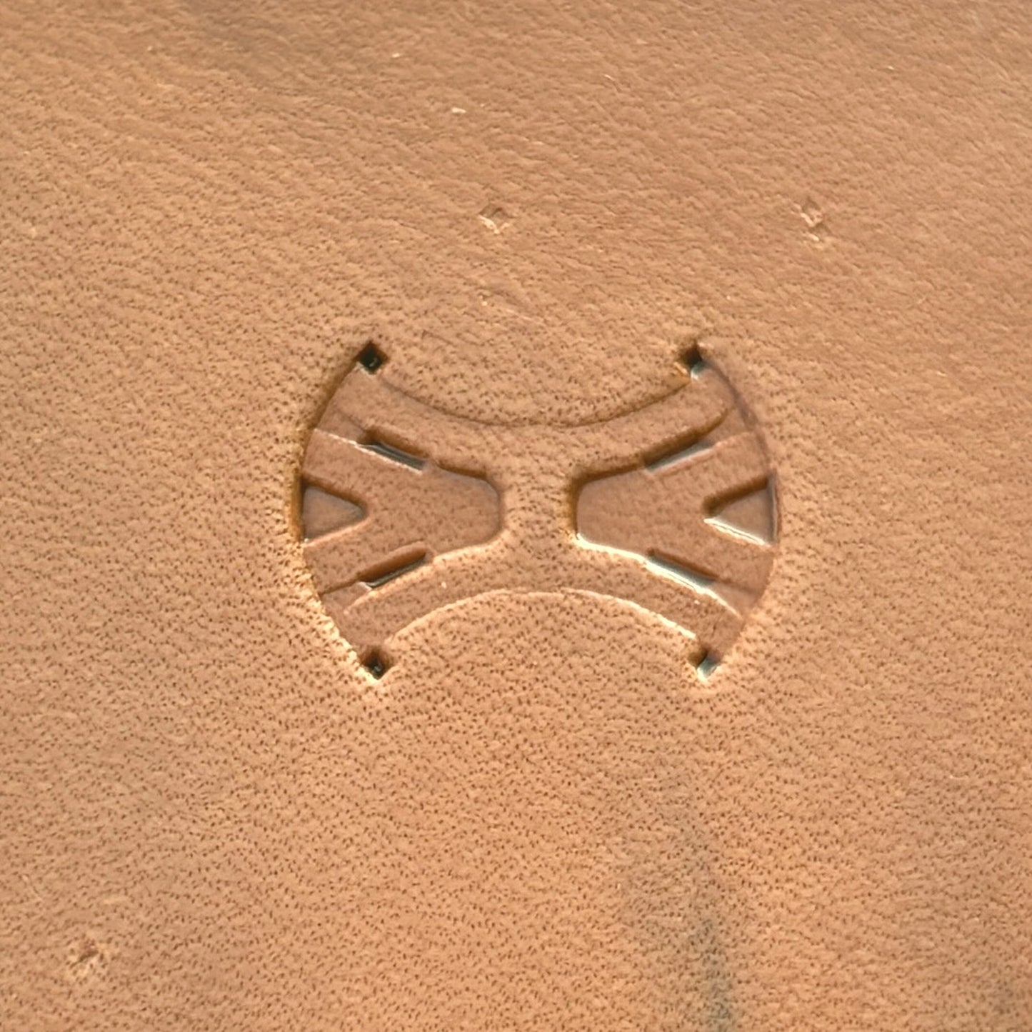 Geometric leather stamp LT014 — single impression on veg-tan leather