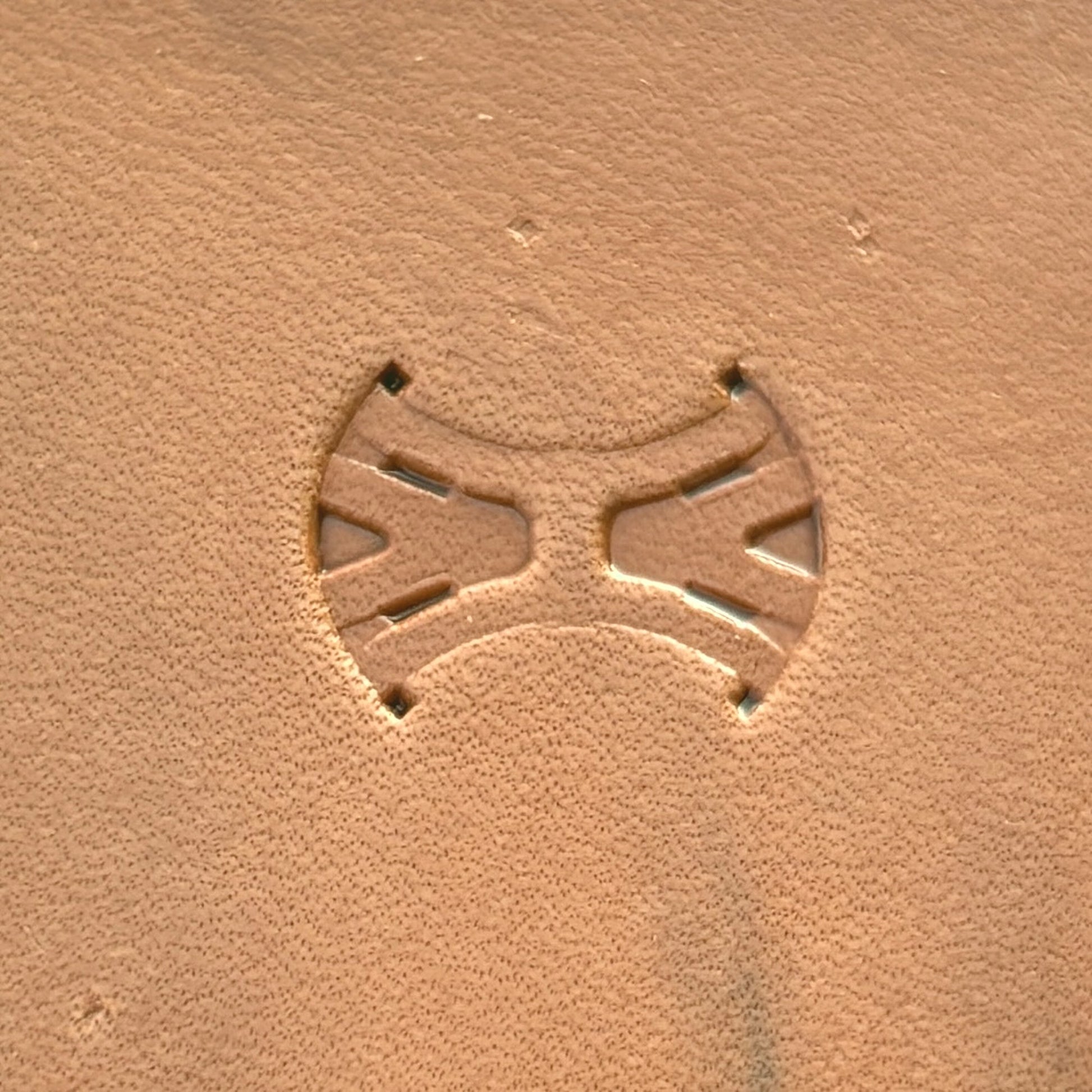 Geometric leather stamp LT014 — single impression on veg-tan leather
