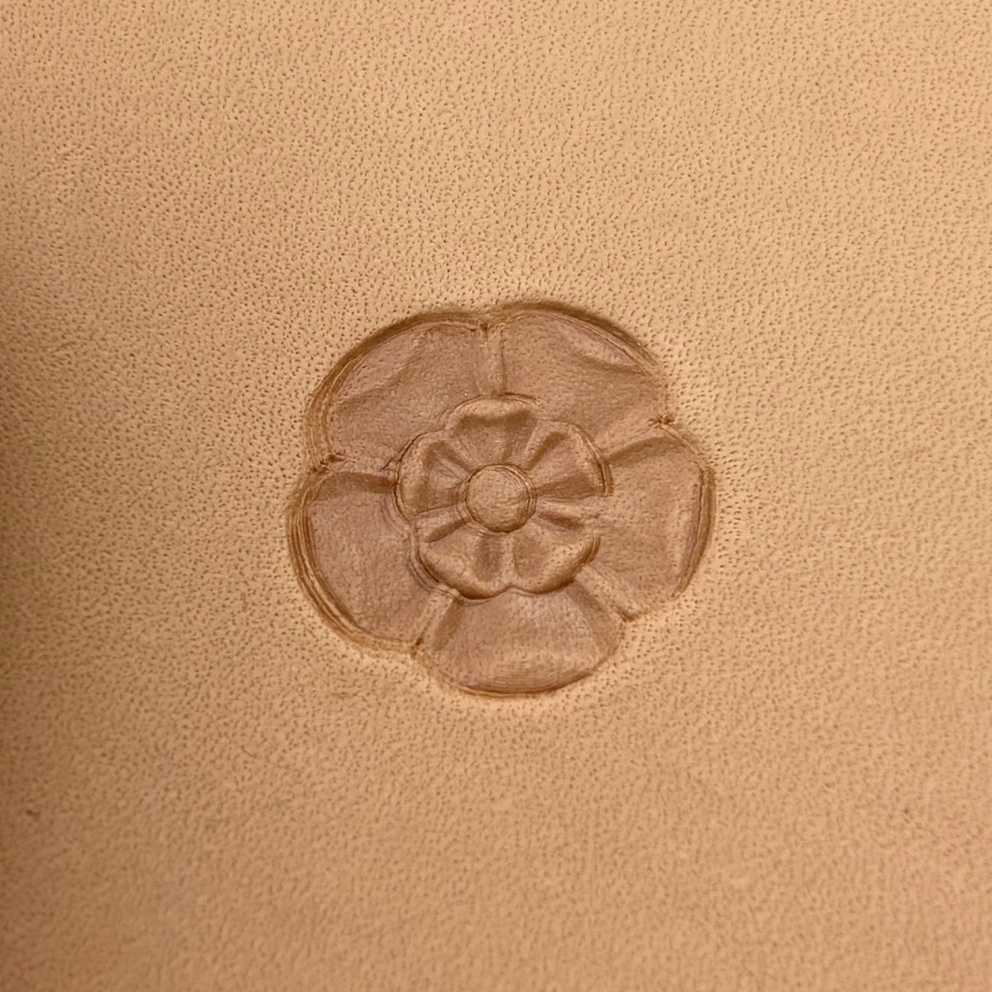 Tudor Flower leather stamp LT017 — single impression on veg-tan leather