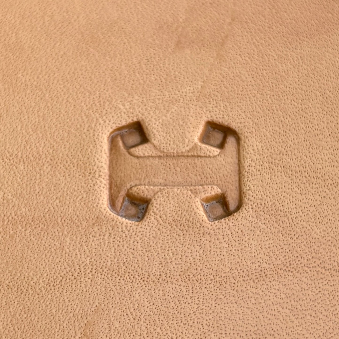 Geometric leather stamp LT018 — single impression on veg-tan leather