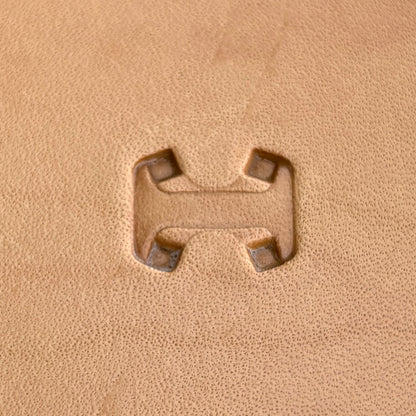 Geometric leather stamp LT018 — single impression on veg-tan leather