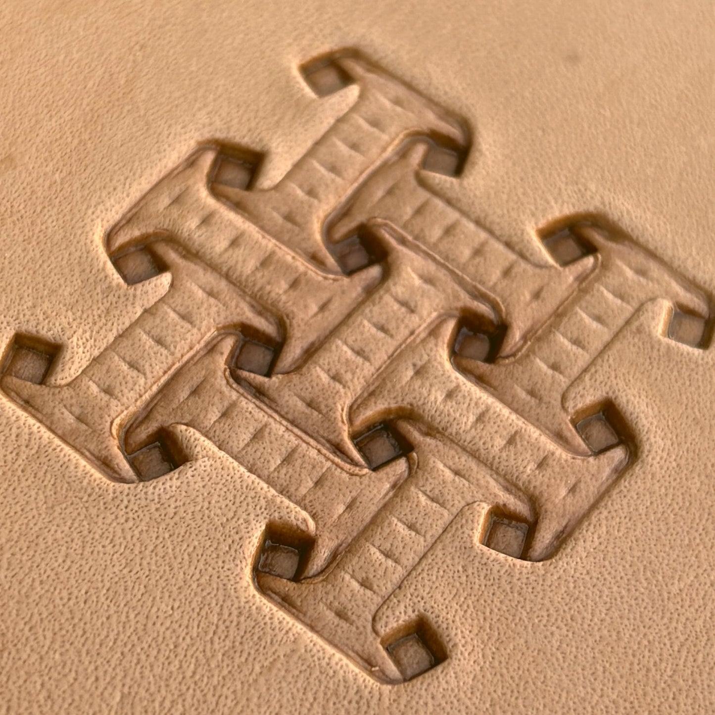 Geometric leather stamp LT020 — imprint on natural veg-tan leather
