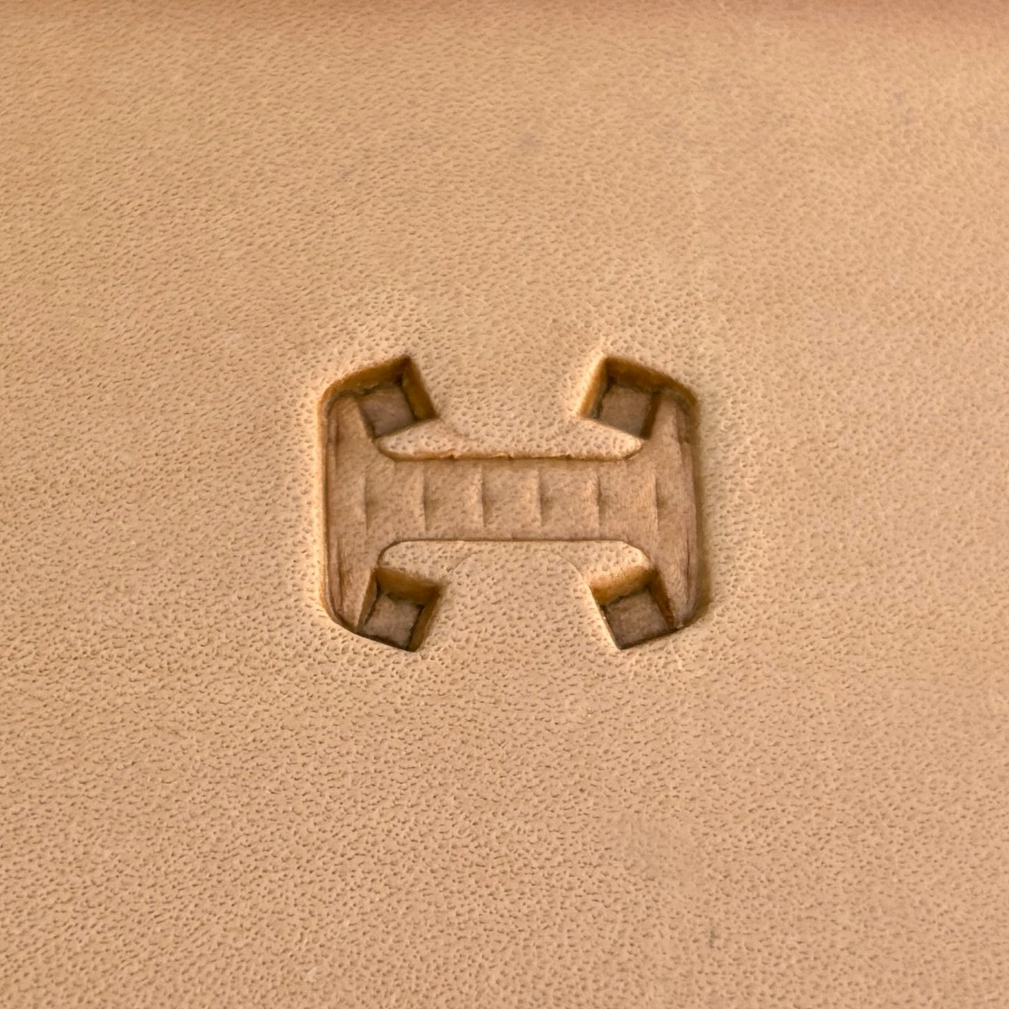Geometric leather stamp LT020 — single impression on veg-tan leather