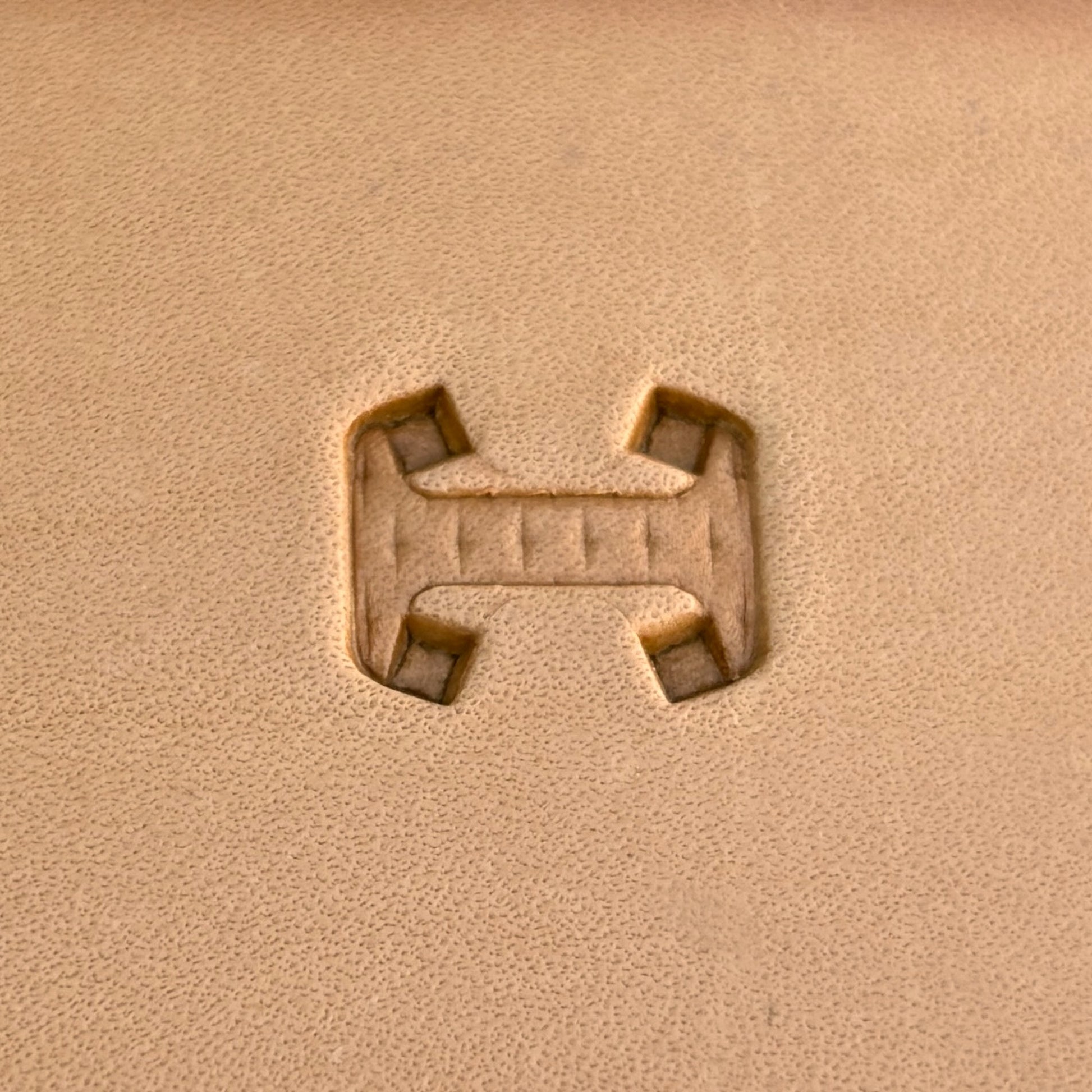 Geometric leather stamp LT020 — single impression on veg-tan leather