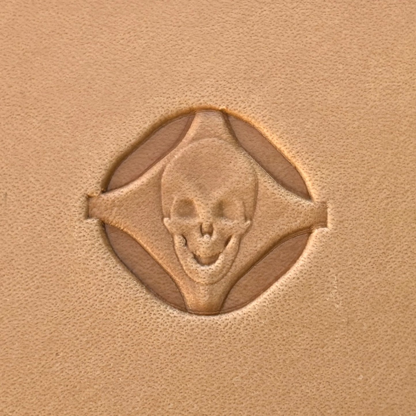 Skull leather stamp LT022 — single impression on veg-tan leather