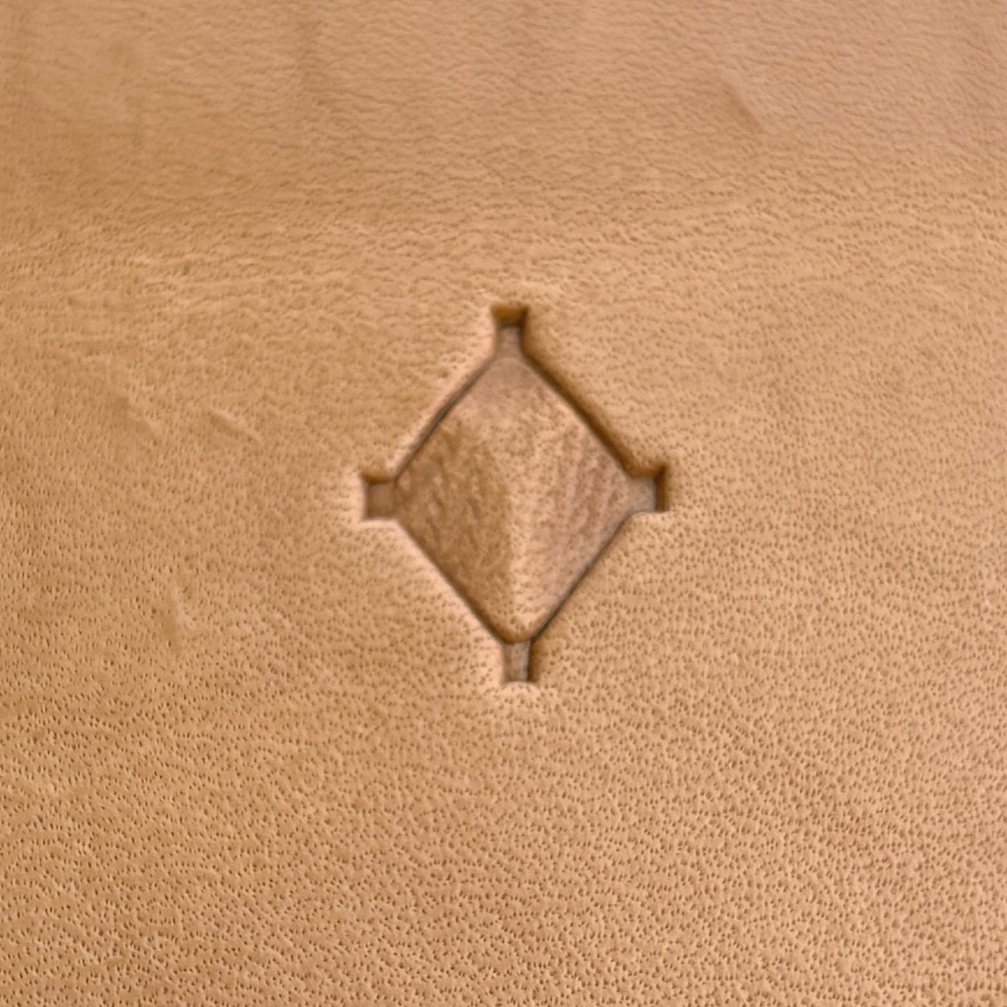 Geometric leather stamp LT024 — single impression on veg-tan leather