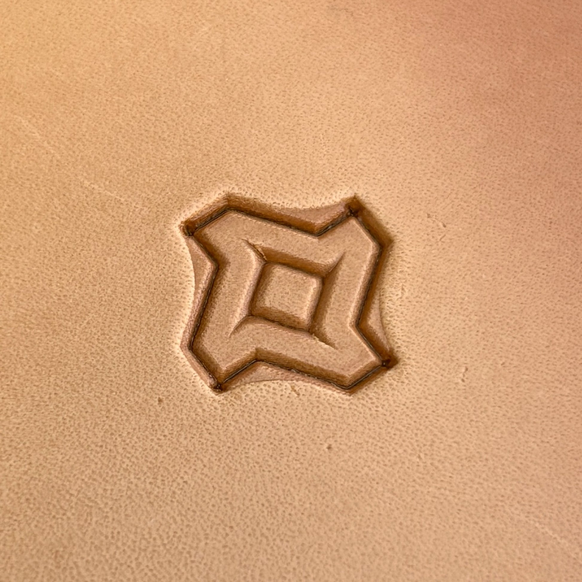 Geometric leather stamp LT026 — single impression on veg-tan leather