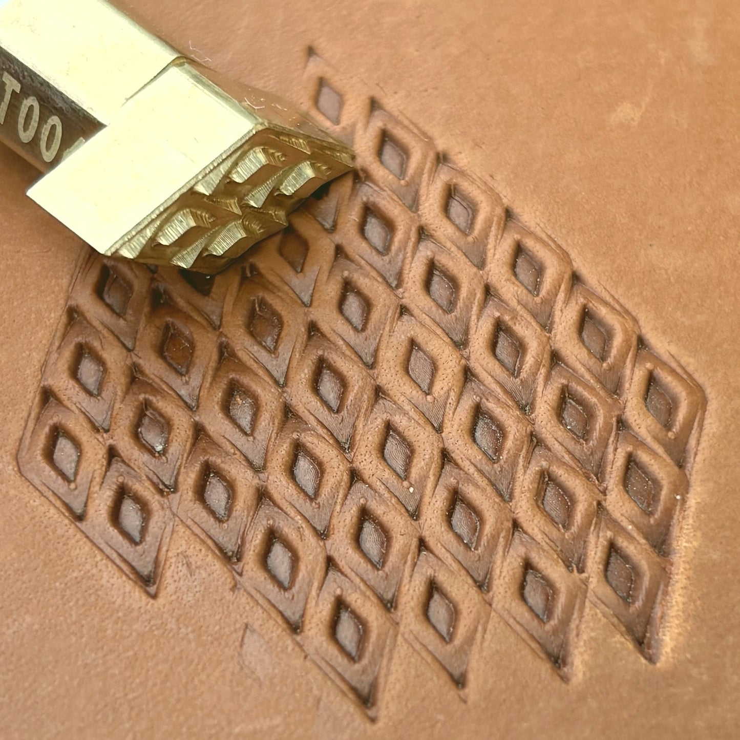Diamond Grid Geometric leather stamp LT028 — brass stamping tool with imprint on natural veg-tan leather