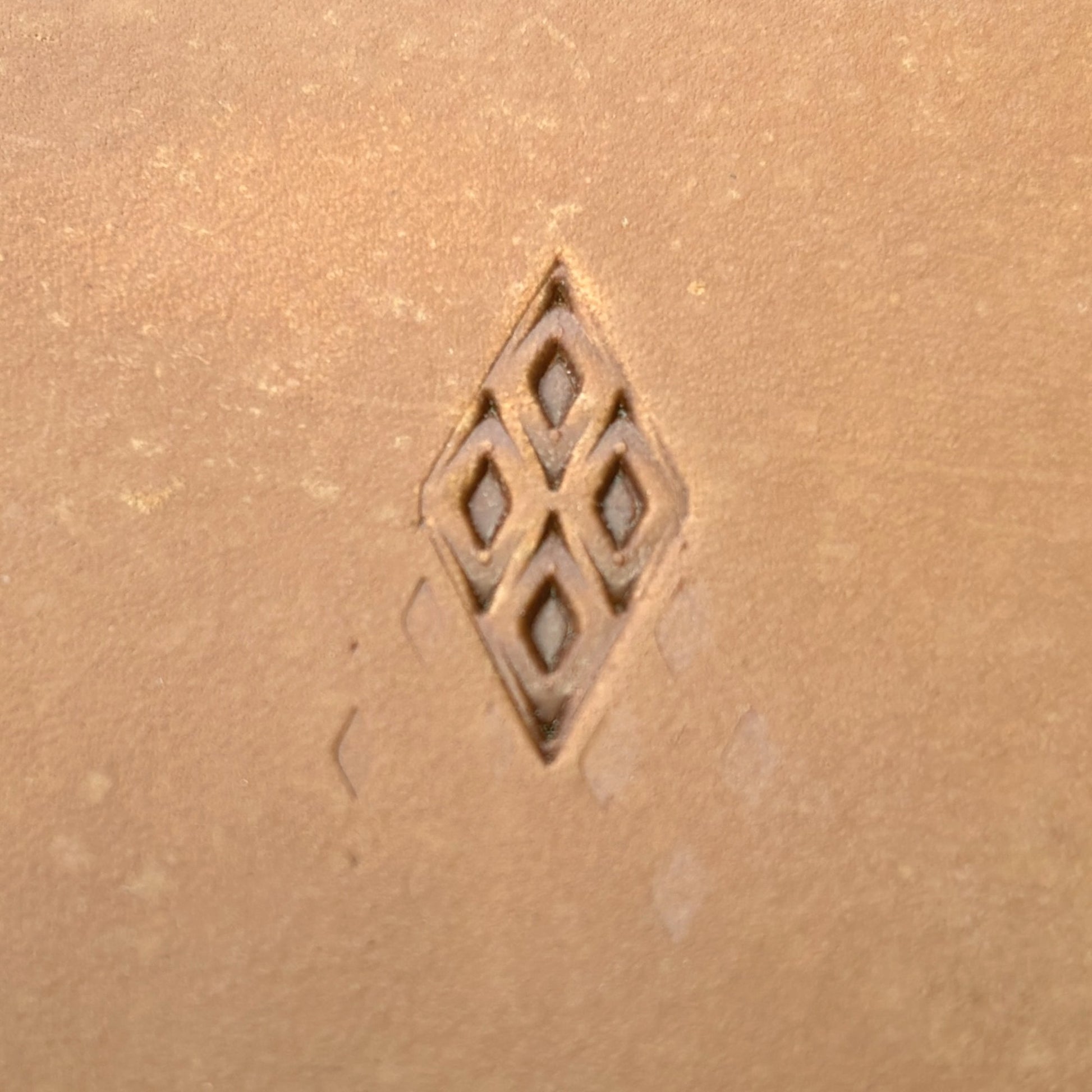 Diamond Grid Geometric leather stamp LT028 — single impression on veg-tan leather
