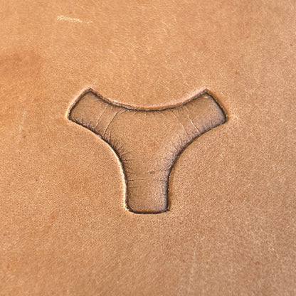 Interlocking Shapes leather stamp LT030 — single impression on veg-tan leather