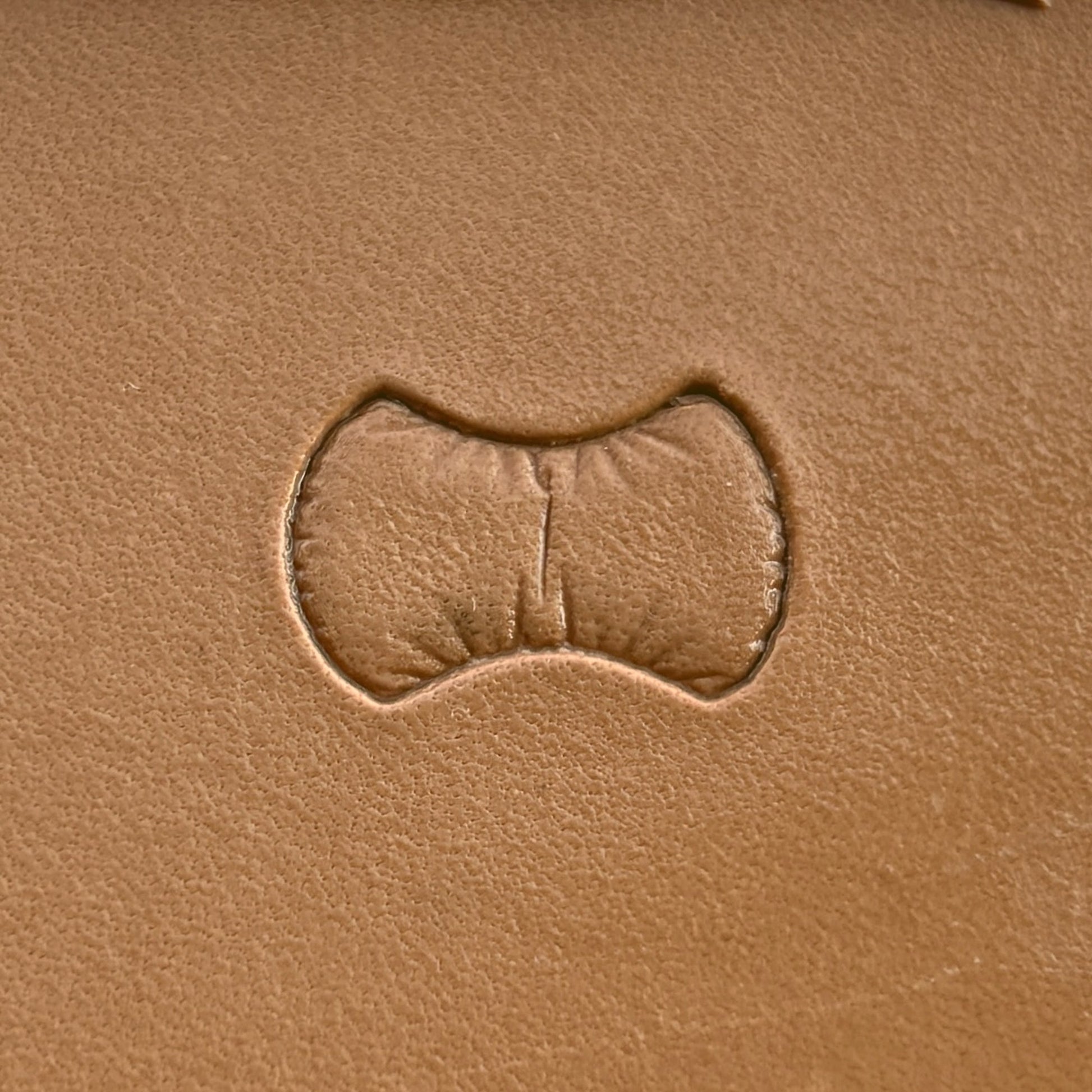 Scales leather stamp LT033 — single impression on veg-tan leather